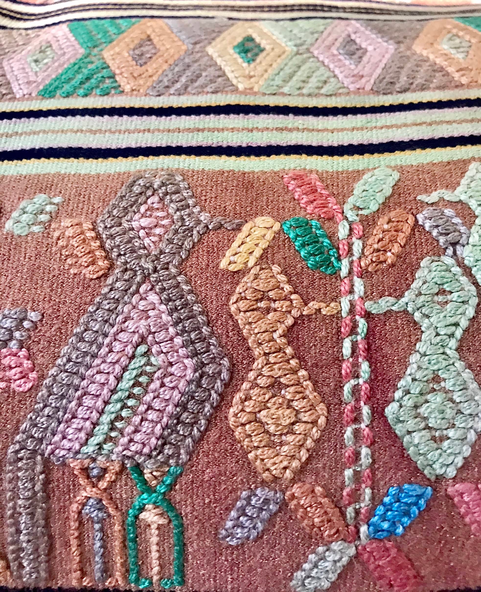 A Pair of Guatemalan Huipil Textile Pillows, vintage, hand embroidered striped tribal hieroglyphic design in aged coral