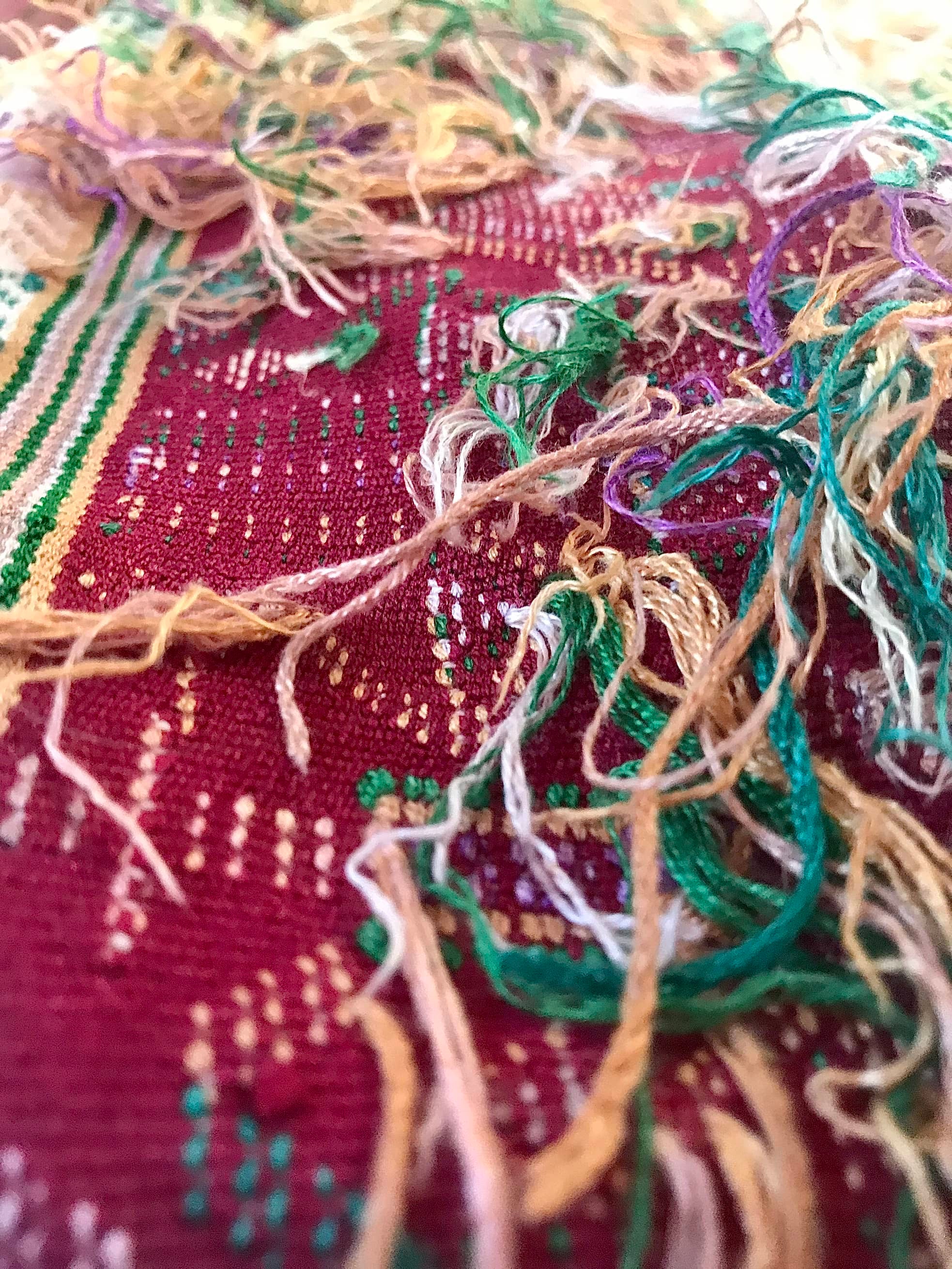 Guatemalan embroidered huipil pillow. Hieroglyphic figures in rows create a strong tribal vibe.