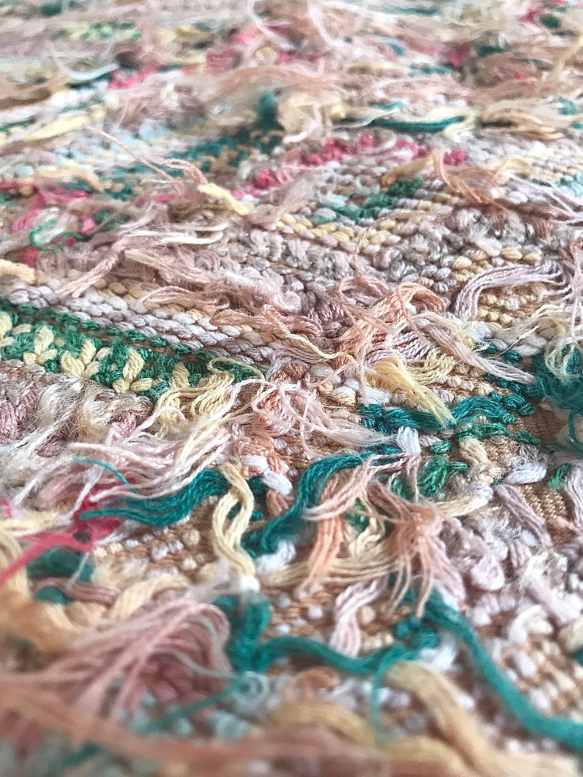 Guatemalan embroidered huipil pillow. Geometric chevron pattern in beige.