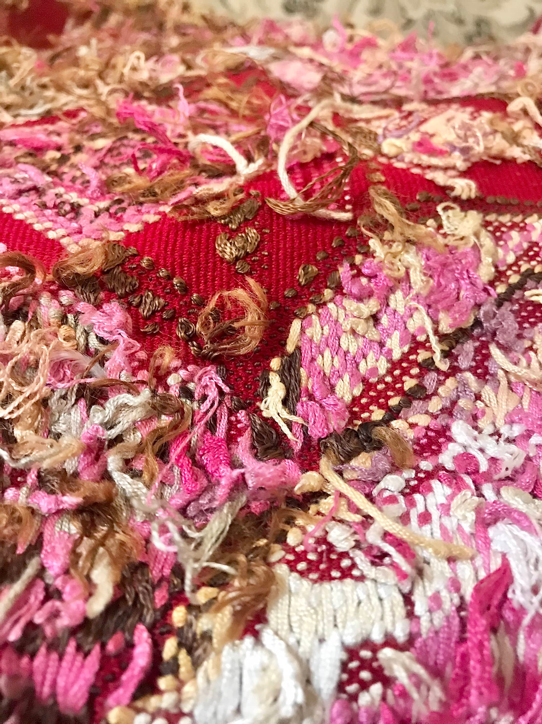 Guatemalan huipil pillow. A vintage textile with a red peacock bird design.