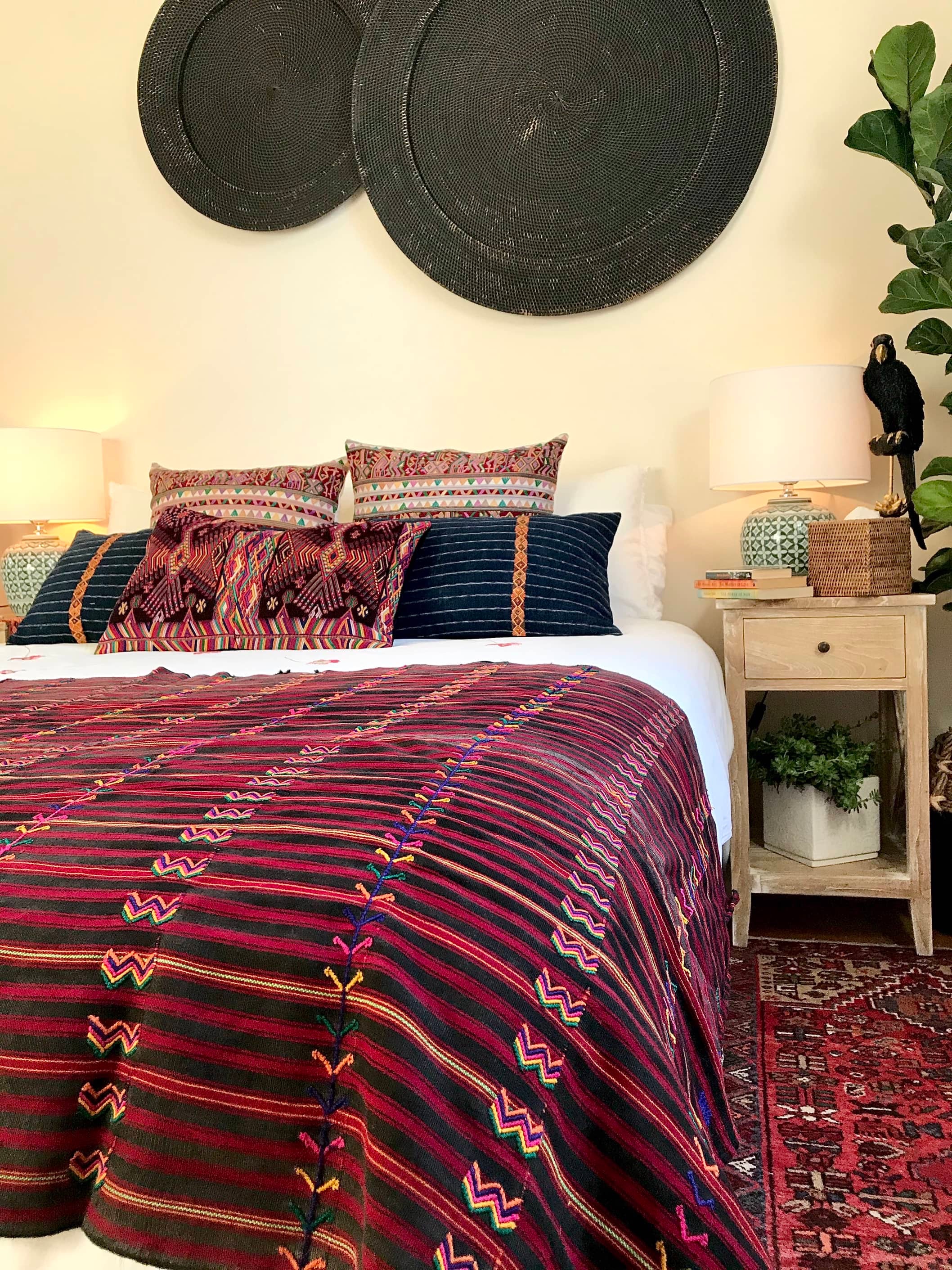 Guatemalan huipil pillow. A darkly exotic vintage textile with a stylised rising phoenix bird design.