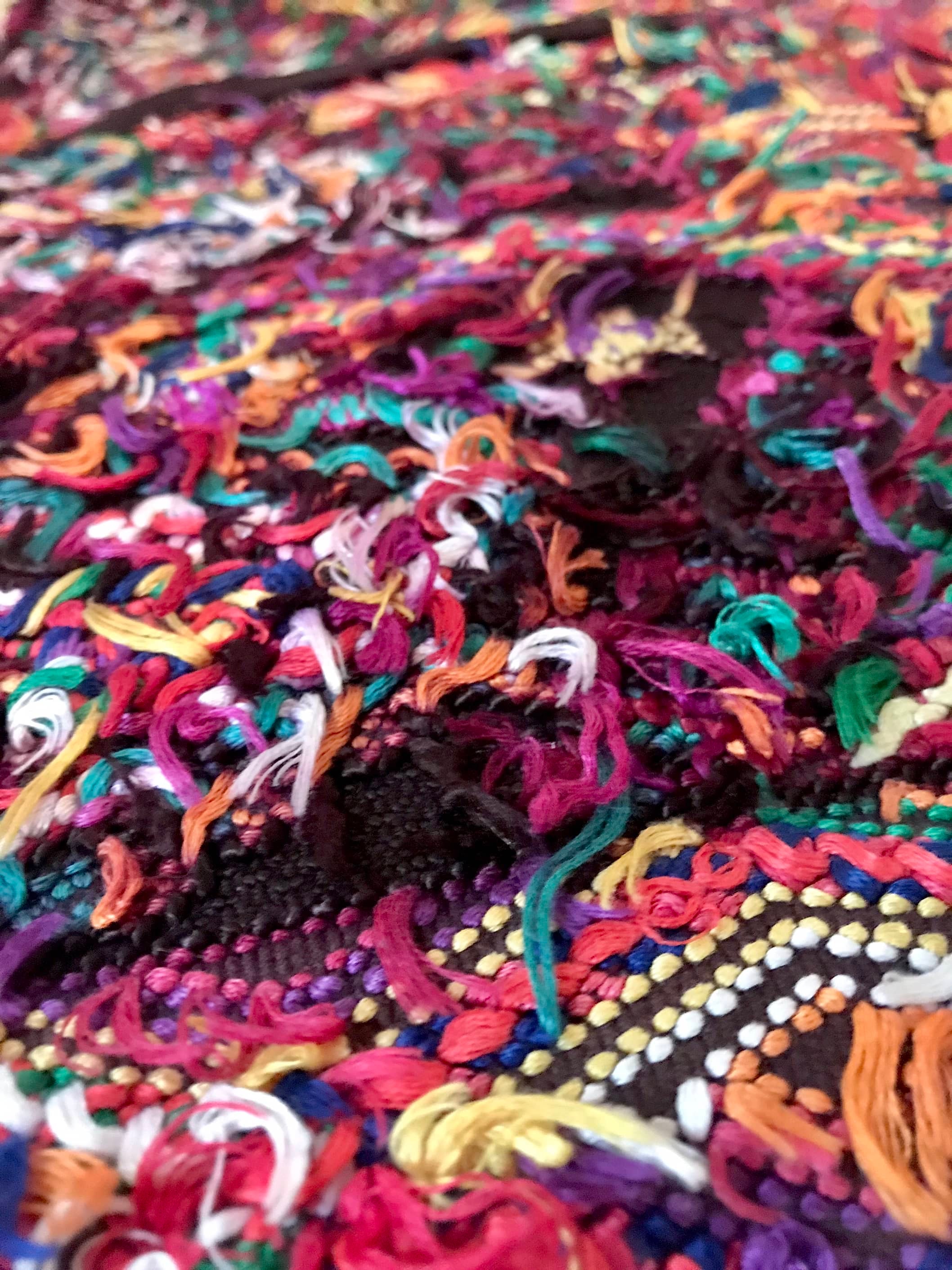 Guatemalan huipil pillow. A darkly exotic vintage textile with a stylised rising phoenix bird design.