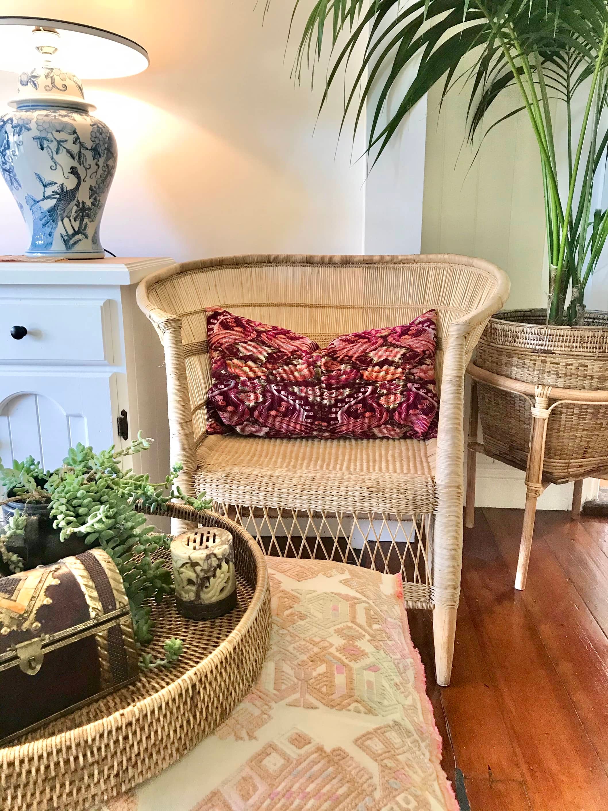 Guatemalan embroidered huipil pillow. Maximilist design of flowers and peacocks in rich burgundy red.