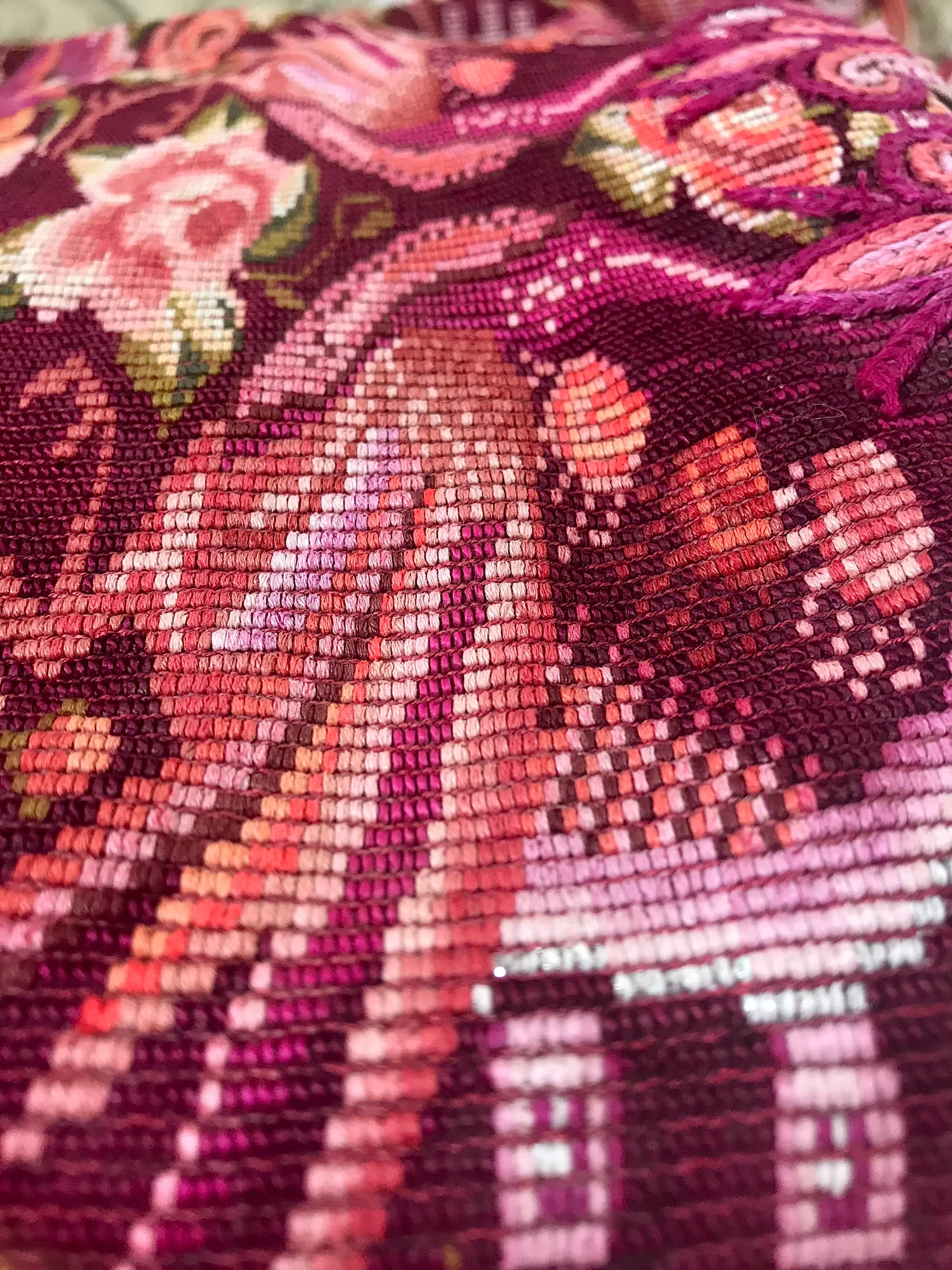Guatemalan embroidered huipil pillow. Maximilist design of flowers and peacocks in rich burgundy red.