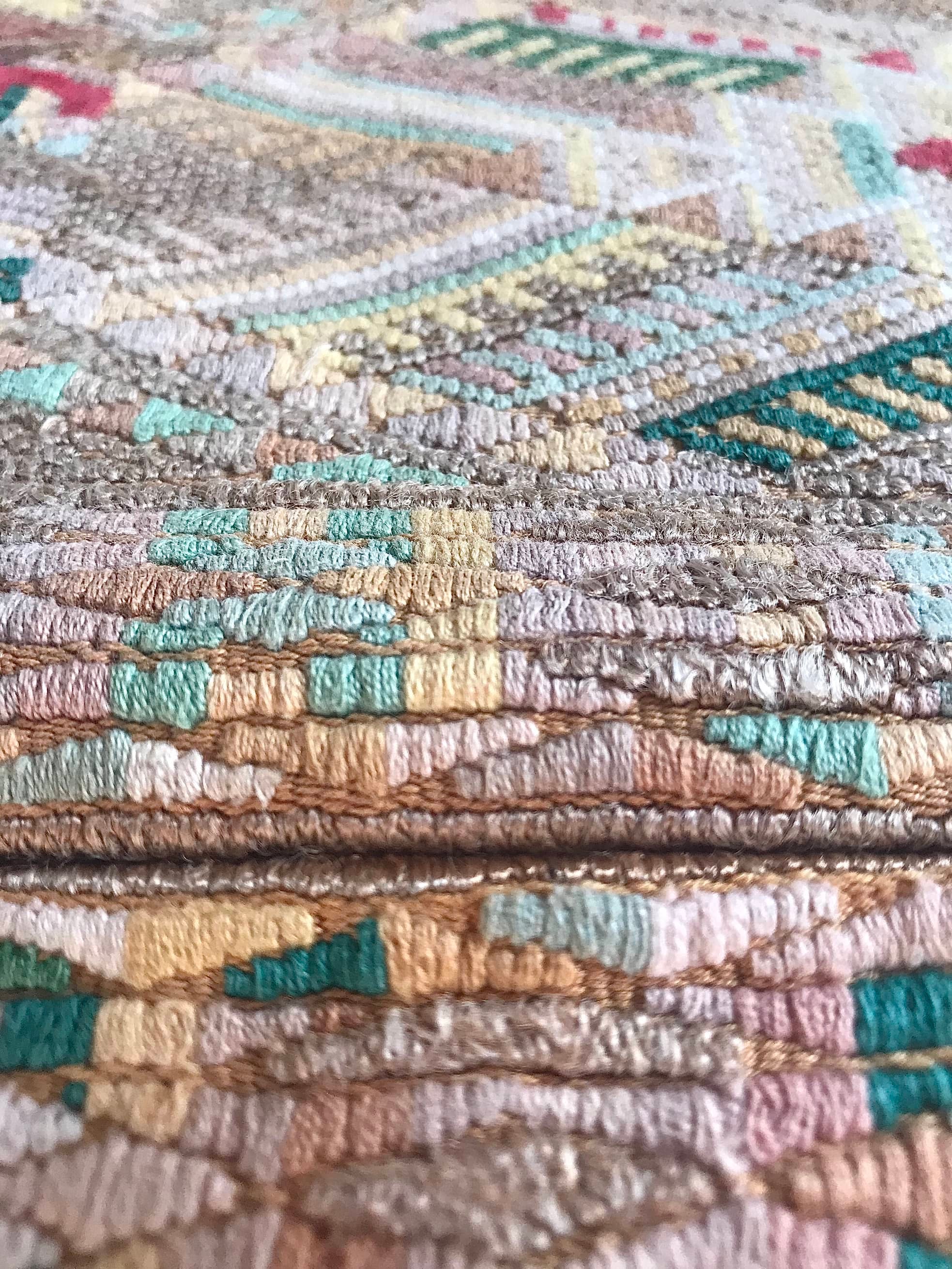 Guatemalan embroidered huipil pillow. Geometric chevron pattern in beige.