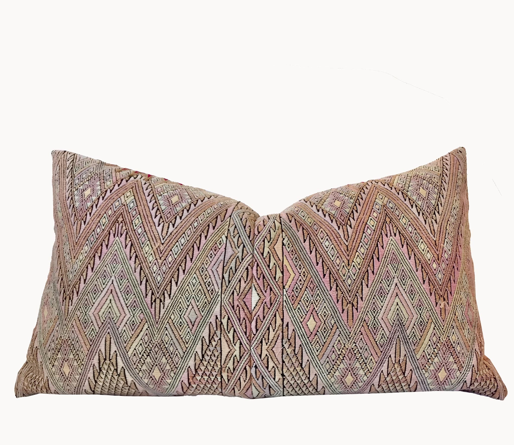Guatemalan embroidered huipil pillow. Geometric chevron pattern in a pale pink palette.