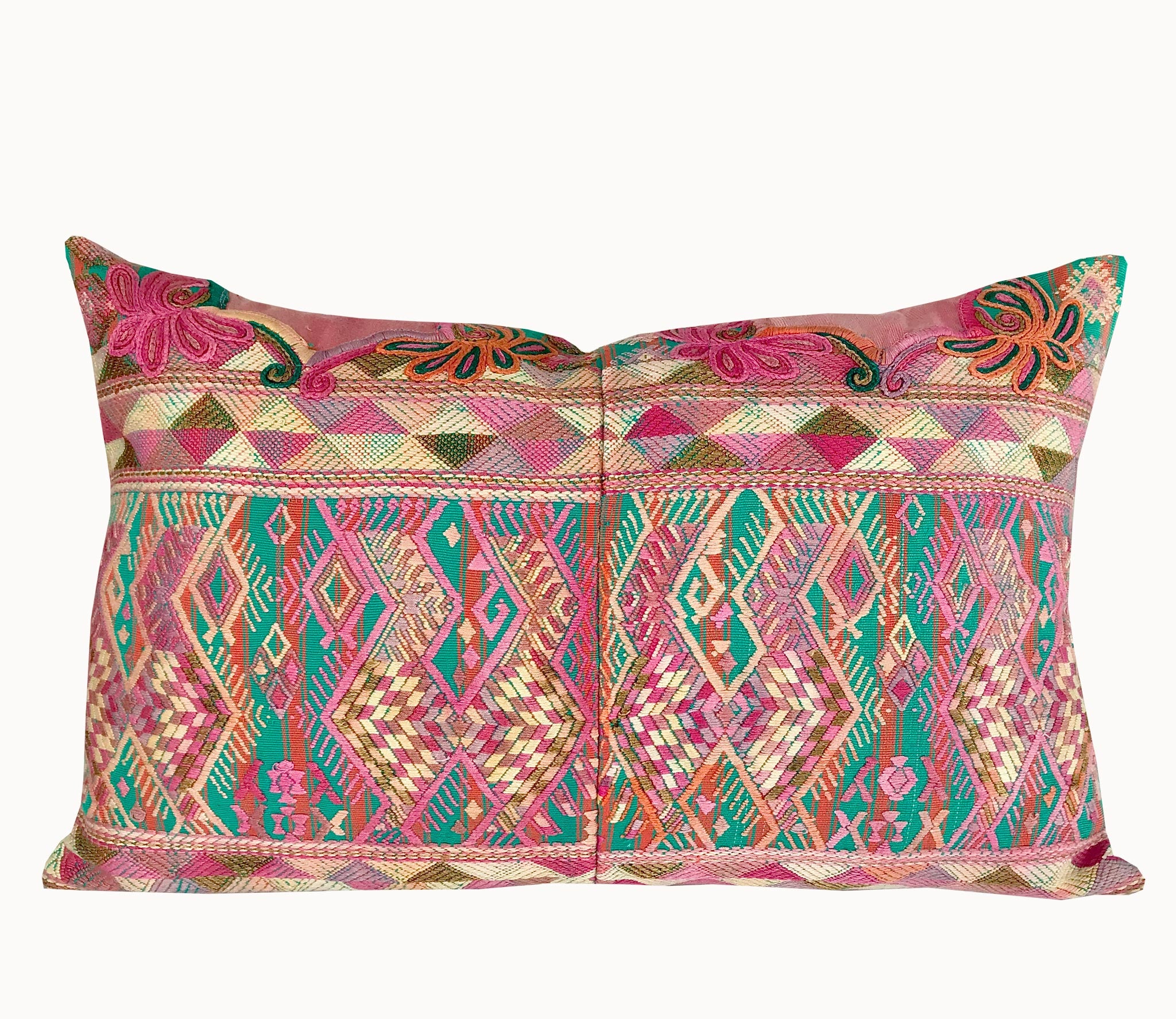 Guatemalan embroidered huipil pillow. A pink and turquoise striped vintage textile with stylised horses.
