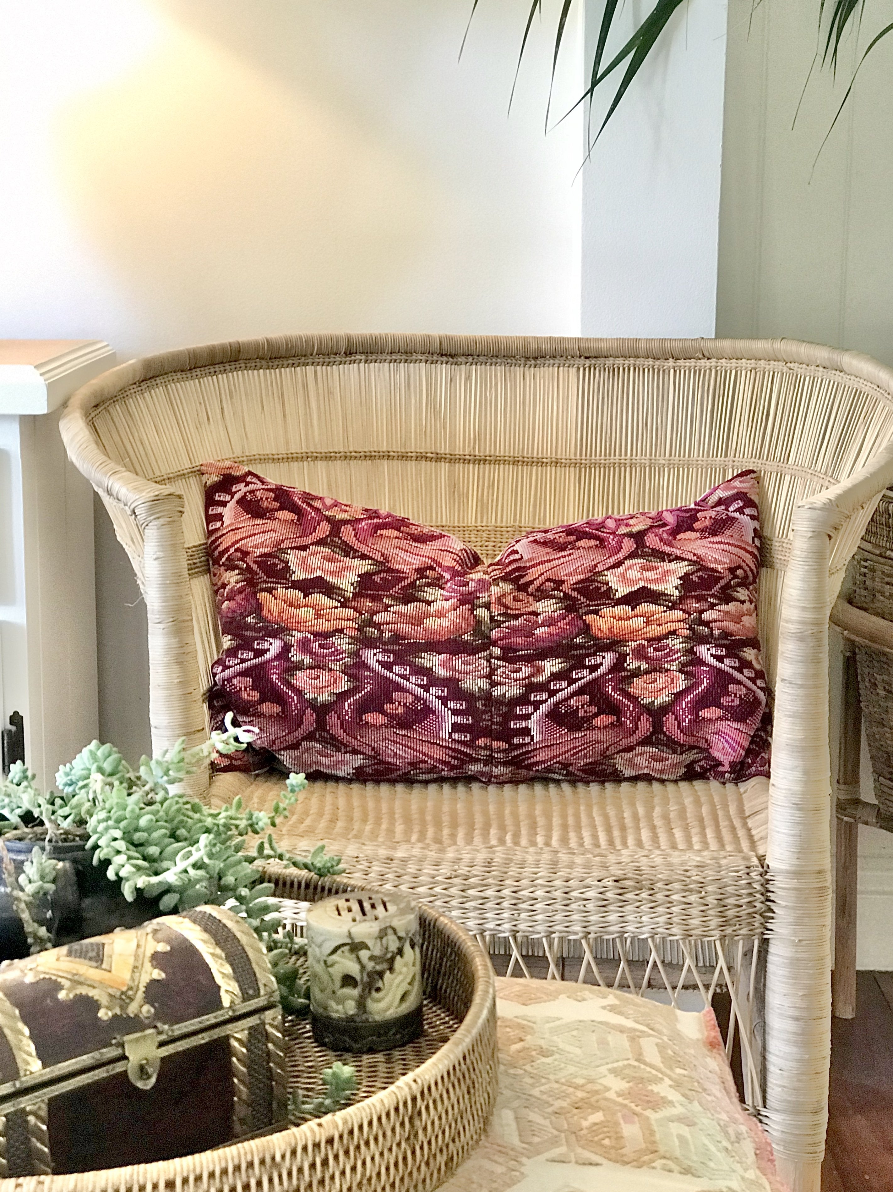 Guatemalan embroidered huipil pillow. Maximilist design of flowers and peacocks in rich burgundy red.