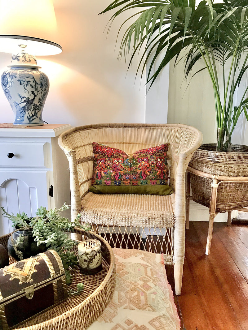 Guatemalan embroidered huipil pillow. Startled owls in a whimsical setting on avocado green cotton