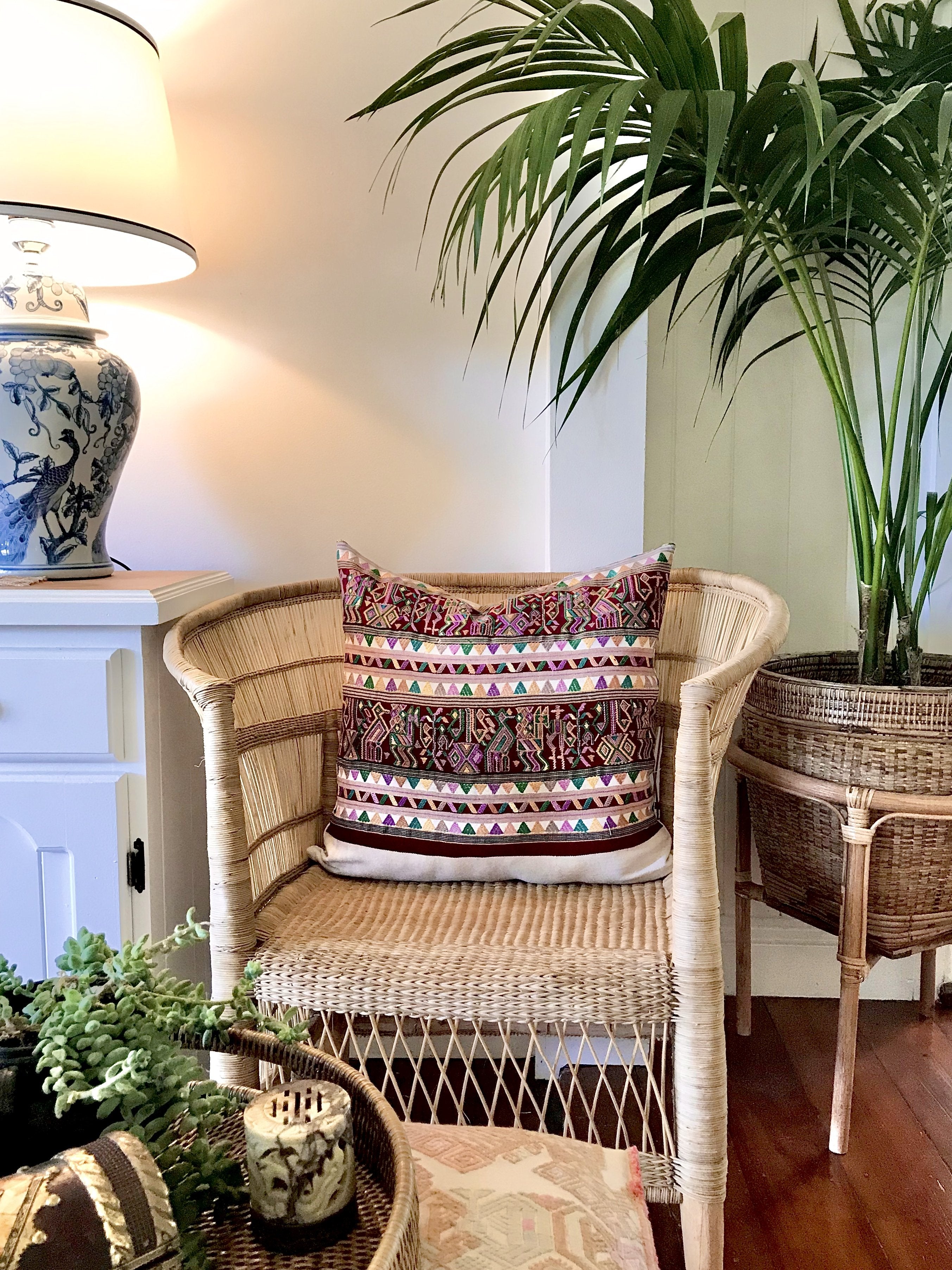 Guatemalan embroidered huipil pillow. Hieroglyphic figures in rows create a strong tribal vibe.