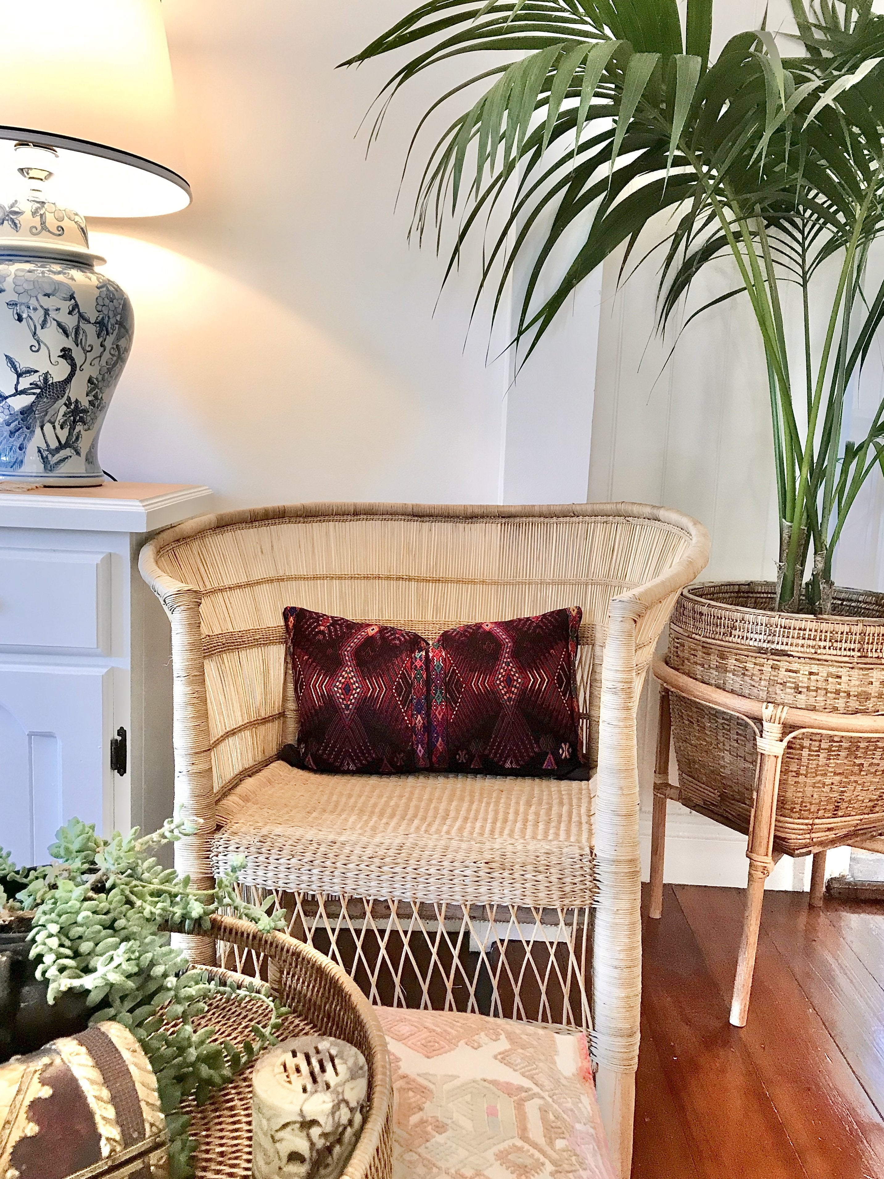 Guatemalan huipil pillow. A darkly exotic vintage textile with a stylised rising phoenix bird design.