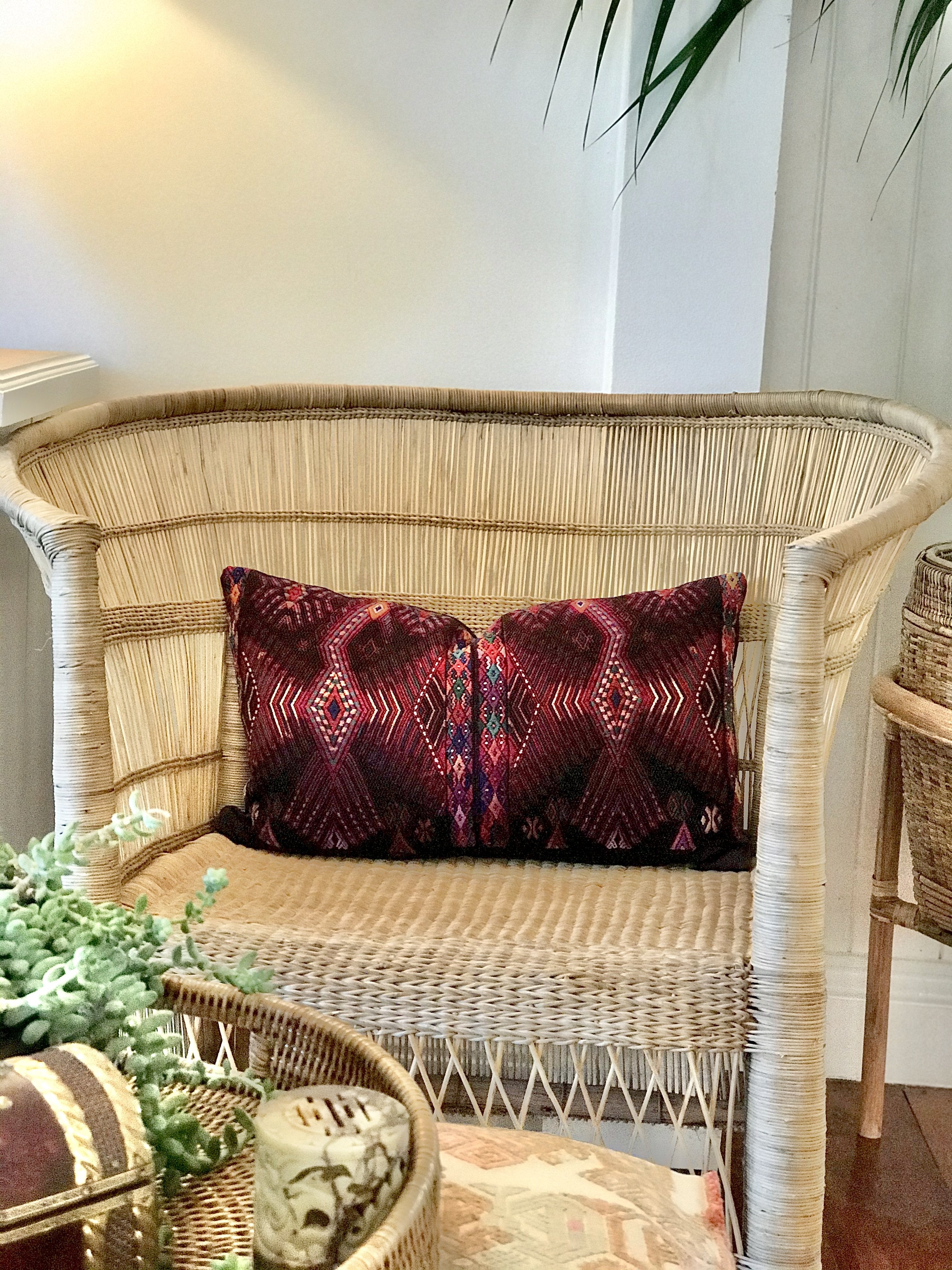 Guatemalan huipil pillow. A darkly exotic vintage textile with a stylised rising phoenix bird design.