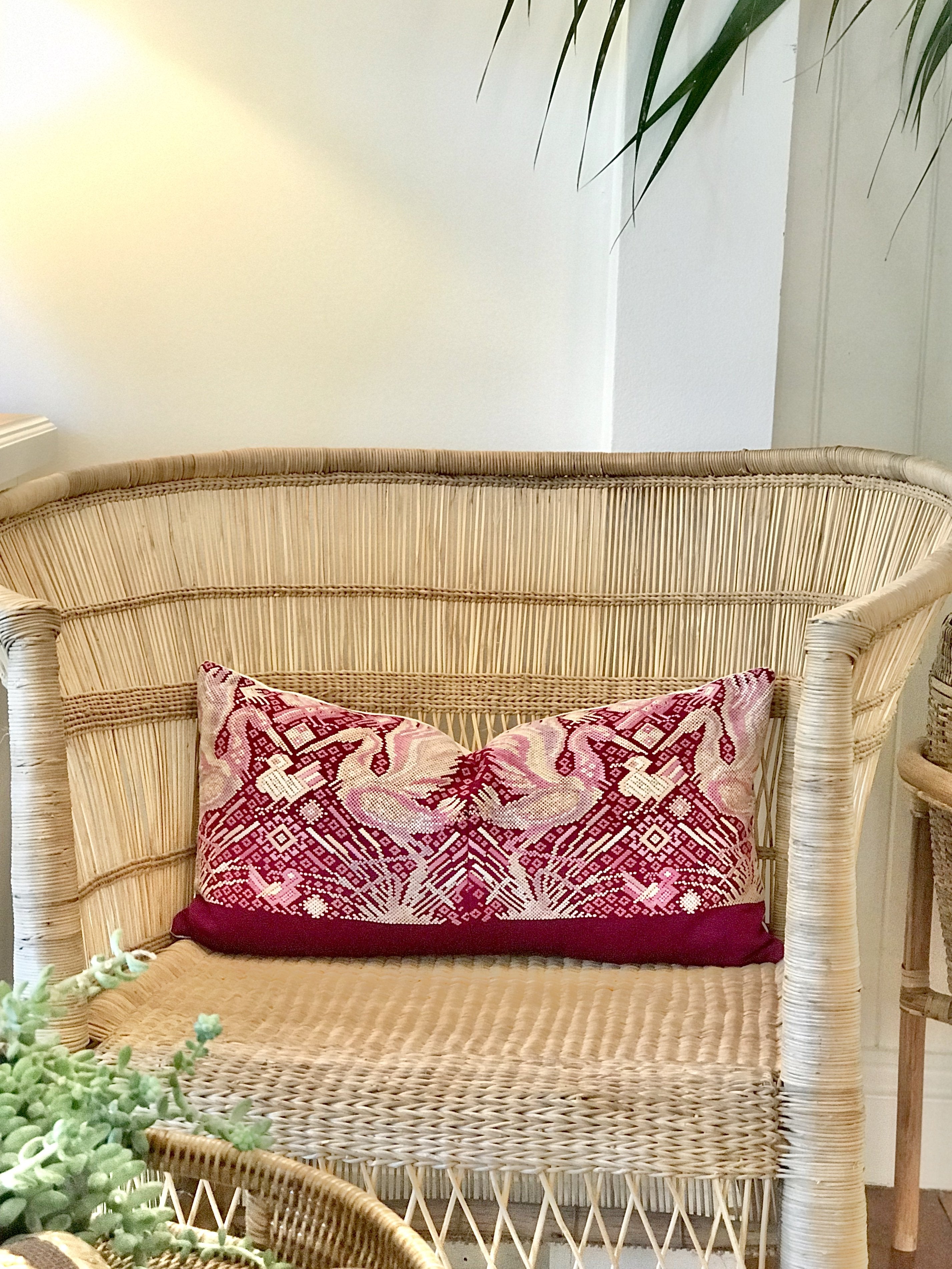 Guatemalan huipil pillow. A fuchsia vintage textile with a chinoiserie style bird design.