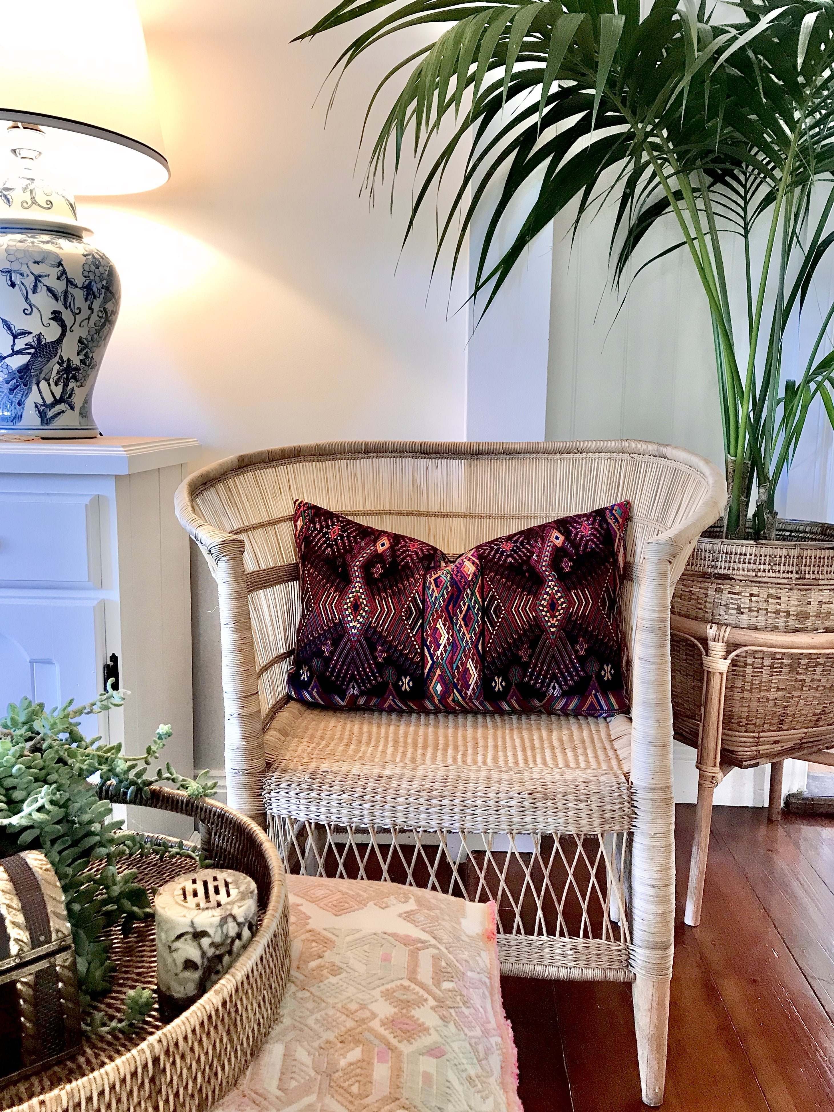 Guatemalan huipil pillow. A darkly exotic vintage textile with a stylised rising phoenix bird design.