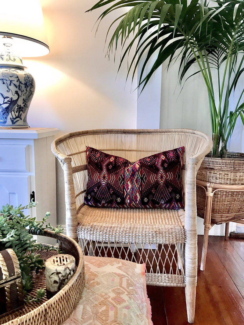 Guatemalan huipil pillow. A darkly exotic vintage textile with a stylised rising phoenix bird design.