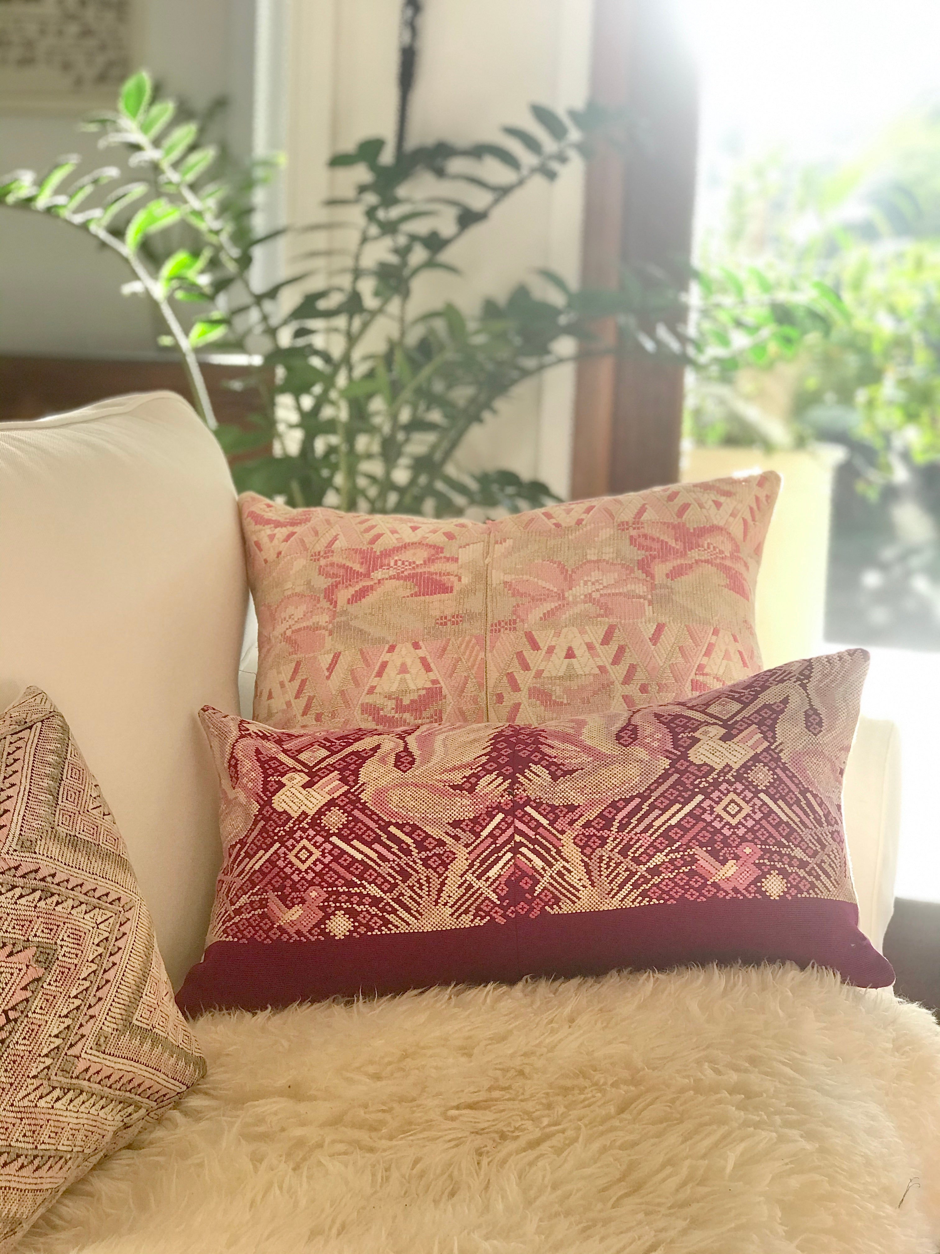 Guatemalan embroidered huipil pillow. Abstract flowers in a pale pink and white palette.