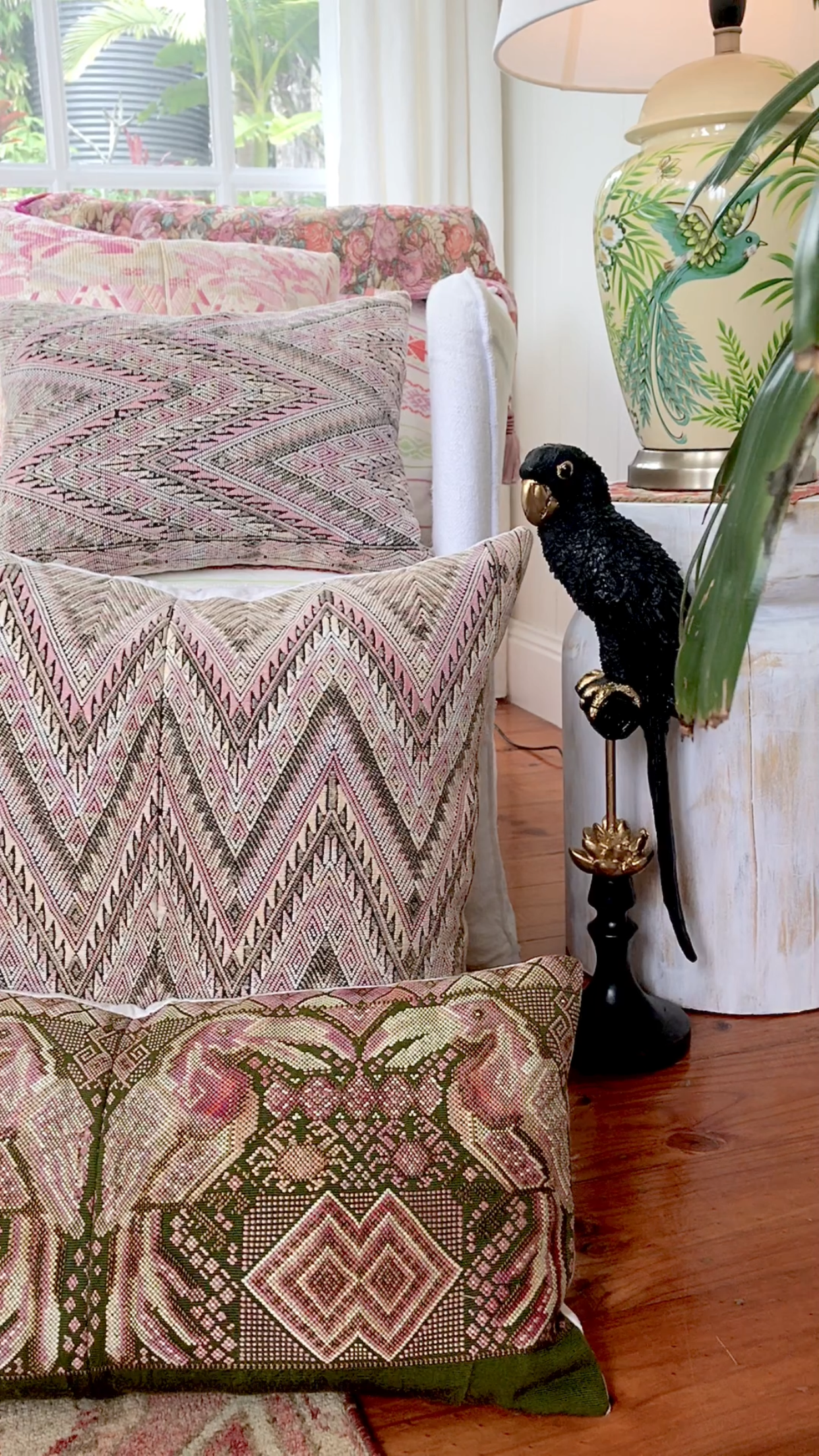 Guatemalan embroidered huipil pillow. Maximilist design of kissing toucan birds and tribal symbols for bohemian decor