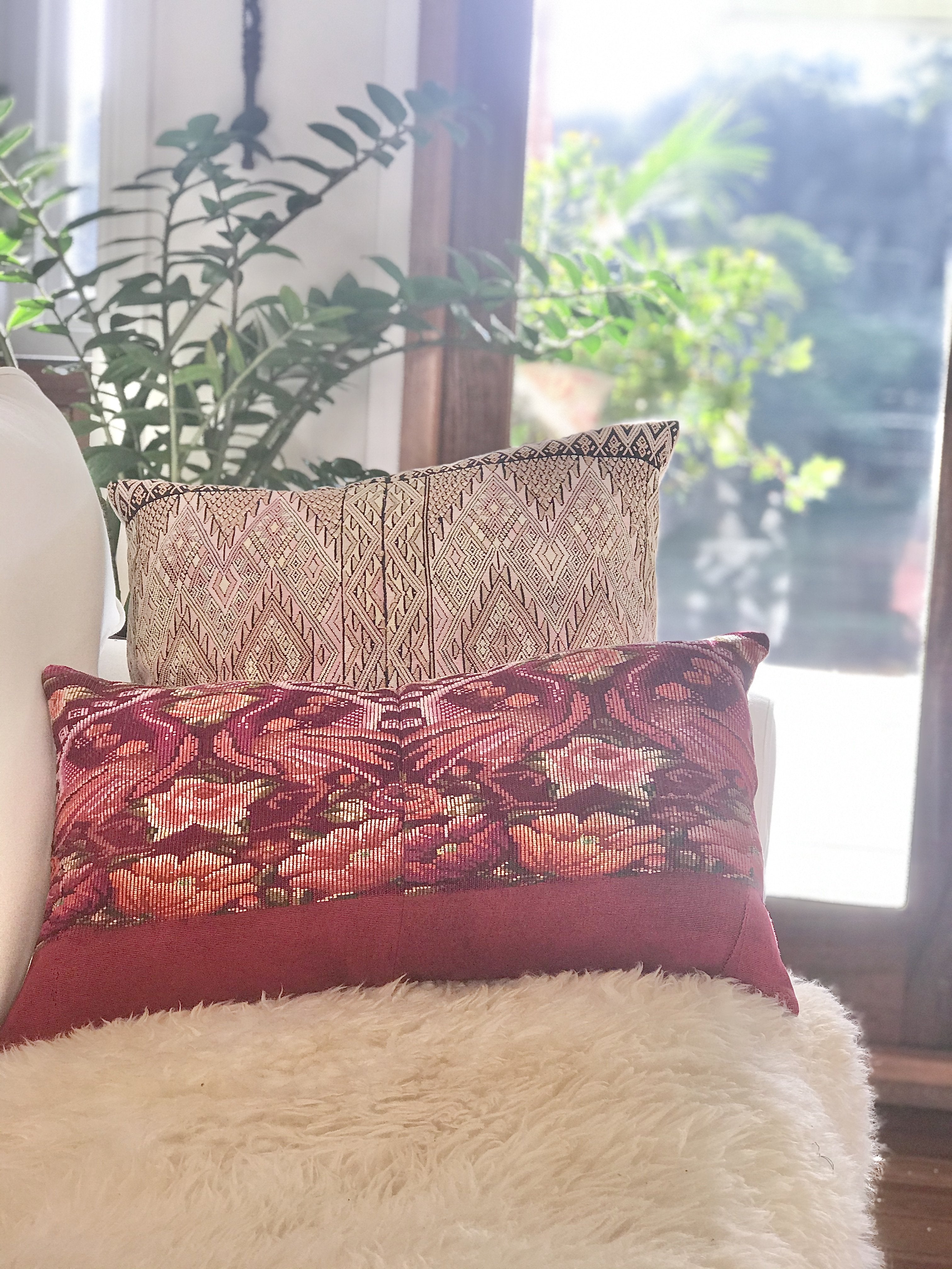 Guatemalan embroidered huipil pillow. Geometric chevron pattern in a pale pink palette for boho decor.