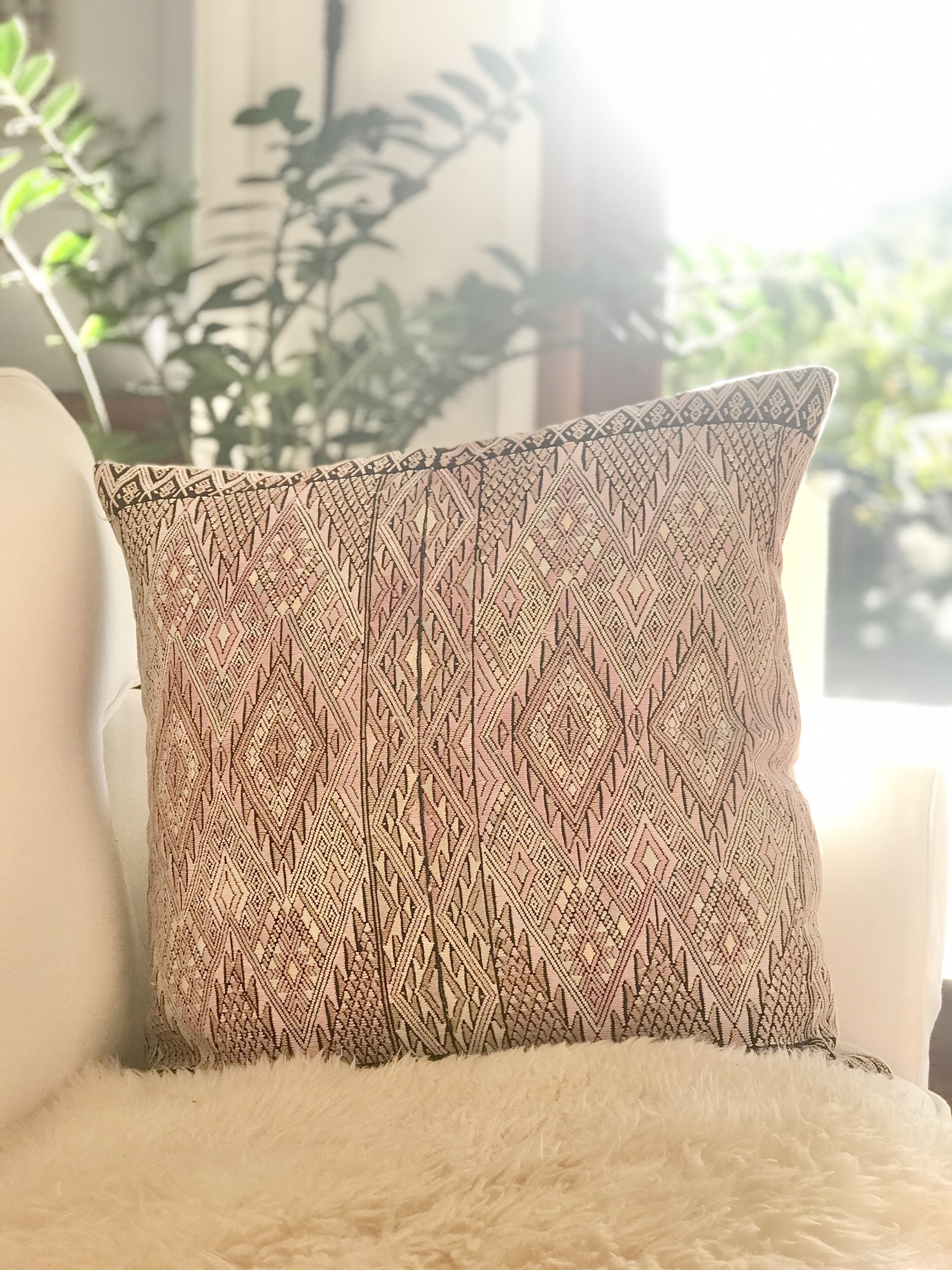 Guatemalan embroidered huipil pillow. Geometric chevron pattern in a pale pink palette for boho decor.