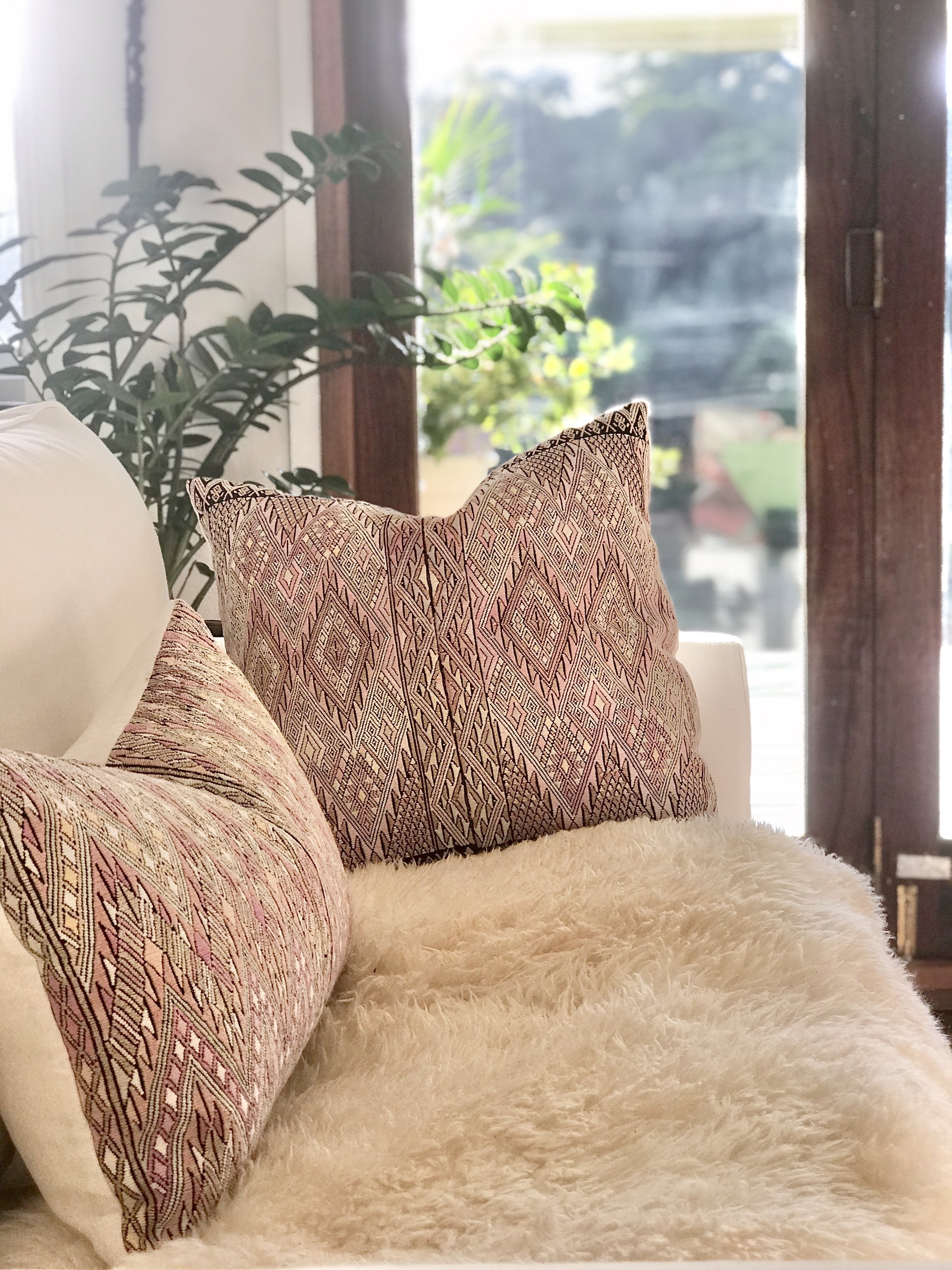 Guatemalan embroidered huipil pillow. Geometric chevron pattern in a pale pink palette for boho decor.