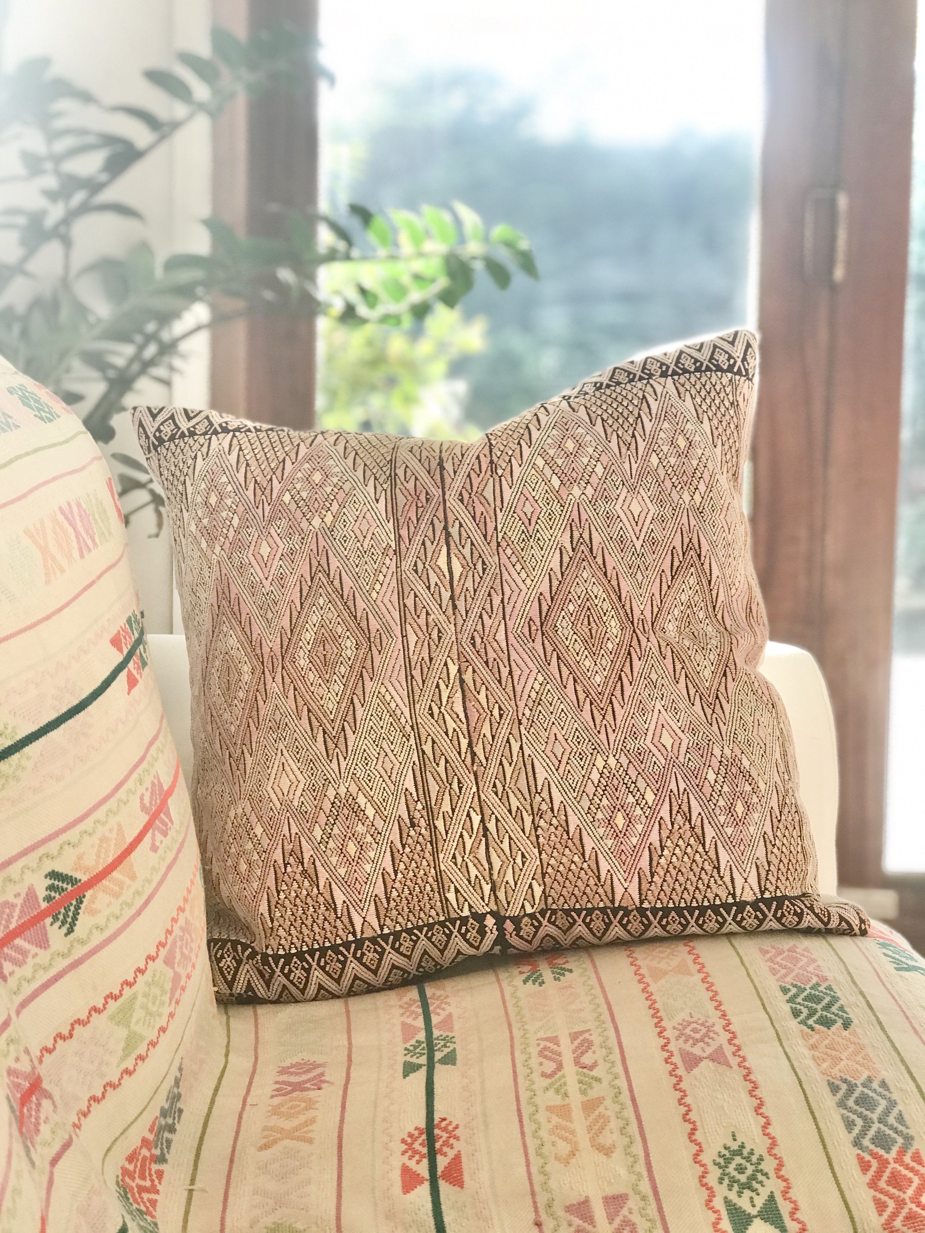 Guatemalan embroidered huipil pillow. Geometric chevron pattern in a pale pink palette for boho decor.