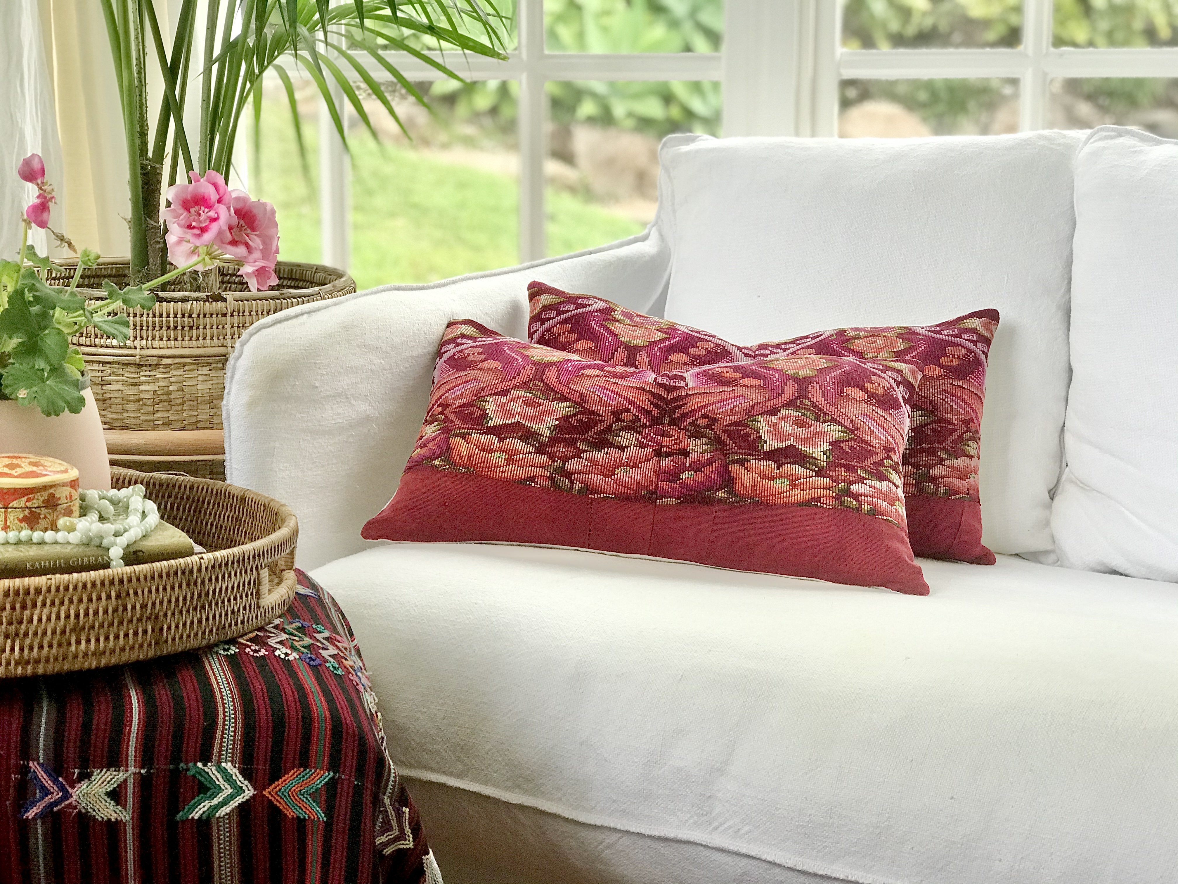 Guatemalan embroidered huipil pillow. Maximilist design of flowers and peacocks in rich burgundy.