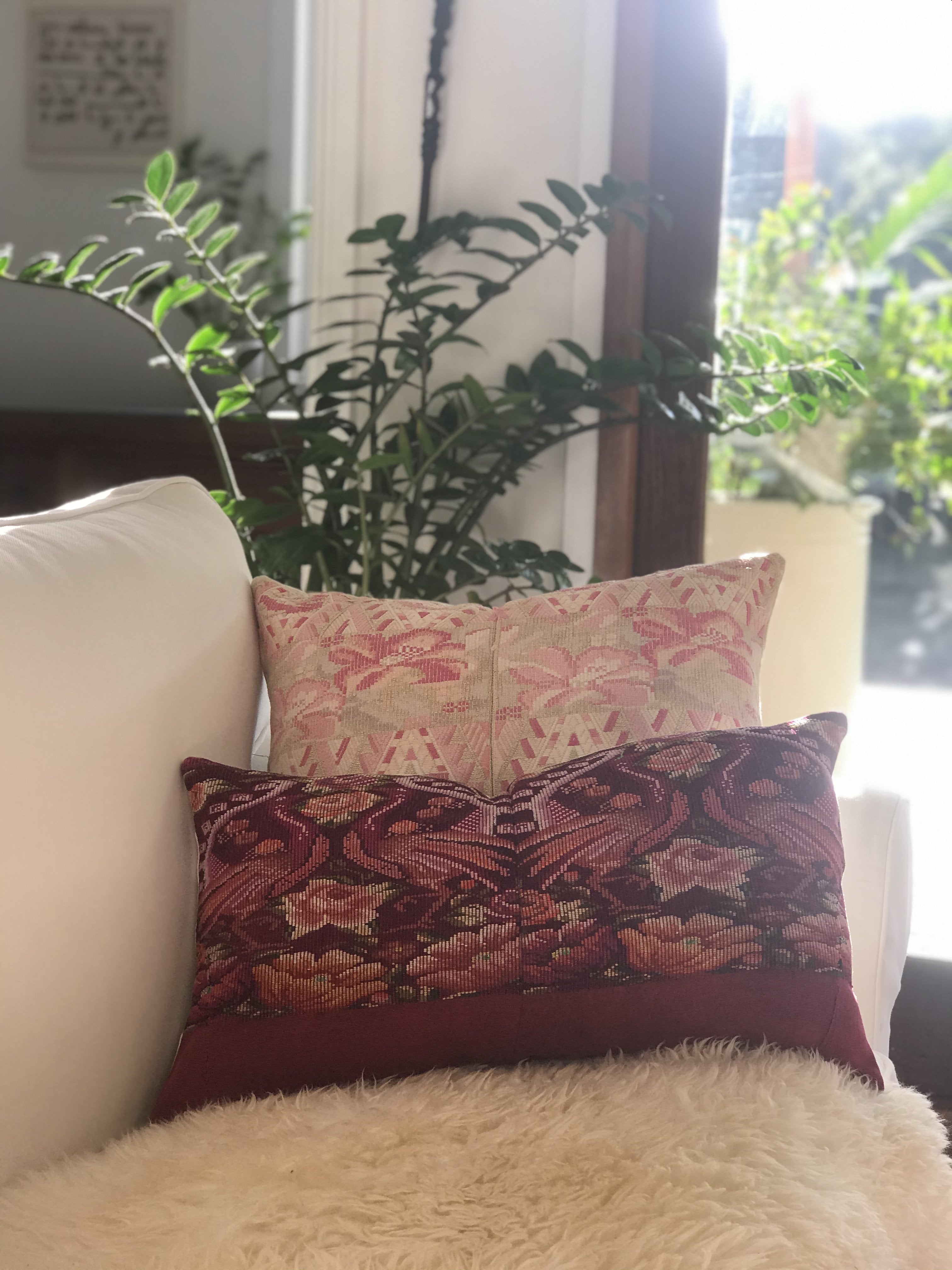 Guatemalan embroidered huipil pillow. Maximilist design of flowers and peacocks in rich burgundy.