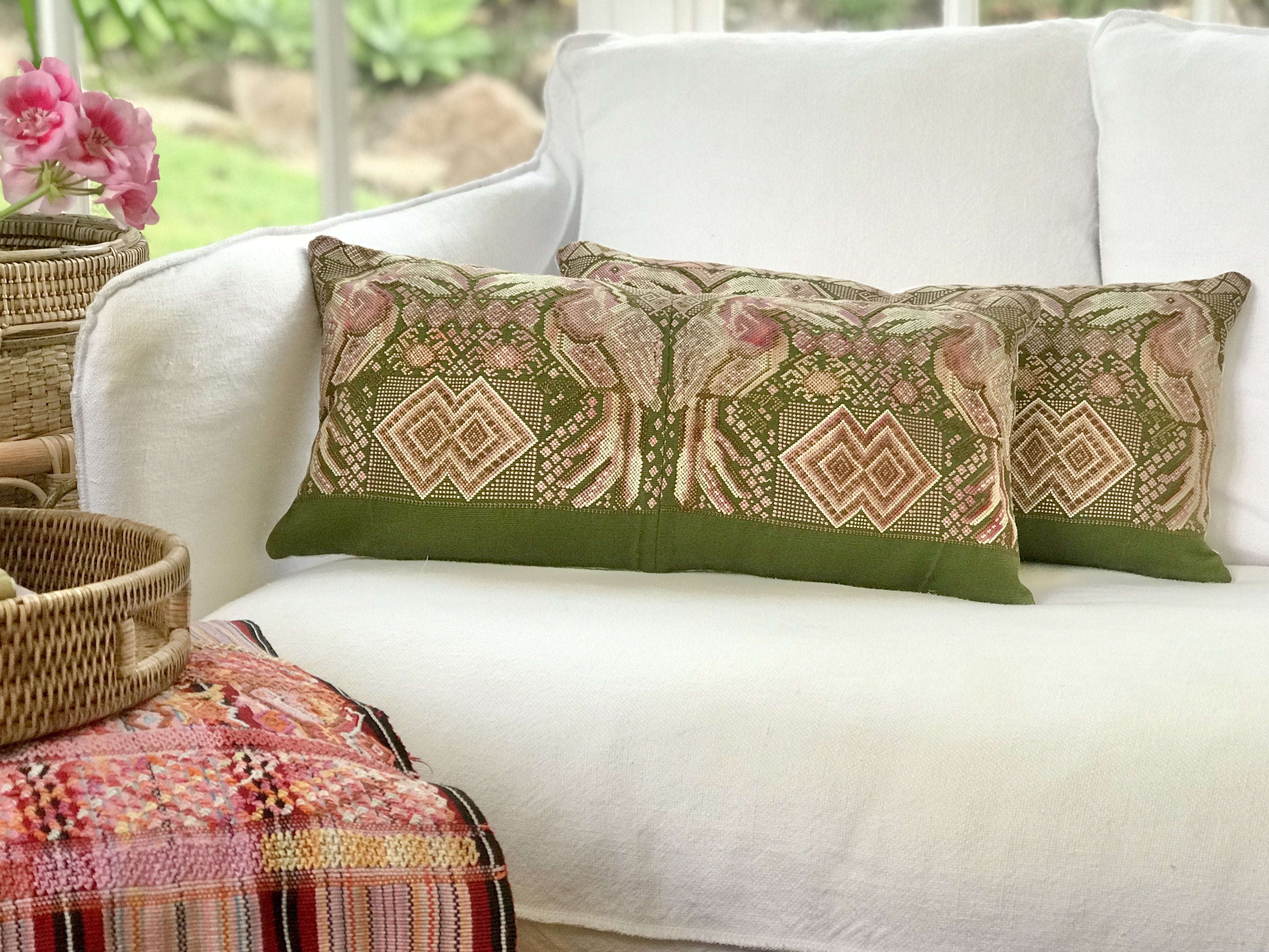 Guatemalan embroidered huipil pillow. Maximilist design of kissing toucan birds and tribal symbols for bohemian decor