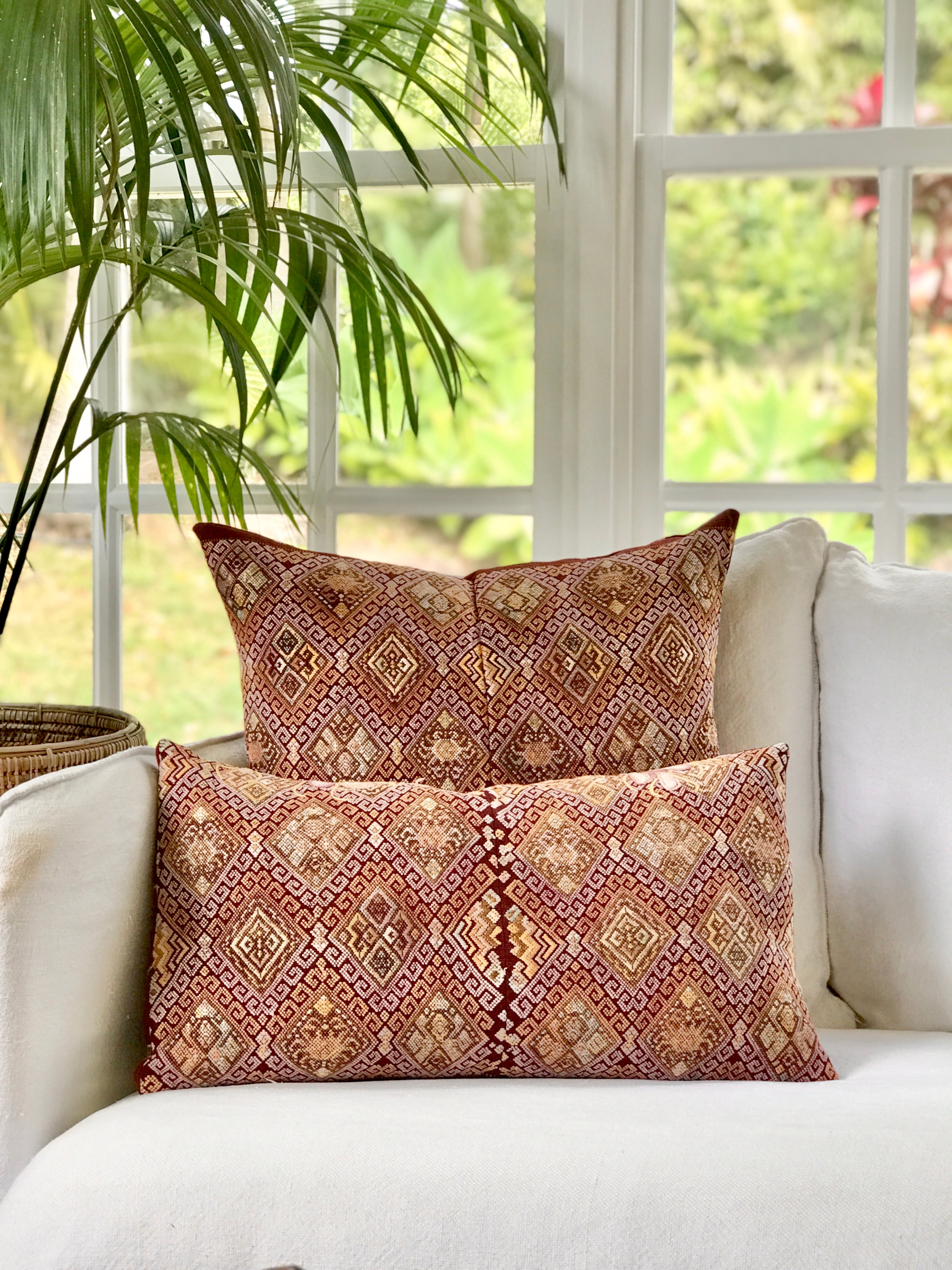 Vintage textile pillows made from a Guatemalan huipil and corte