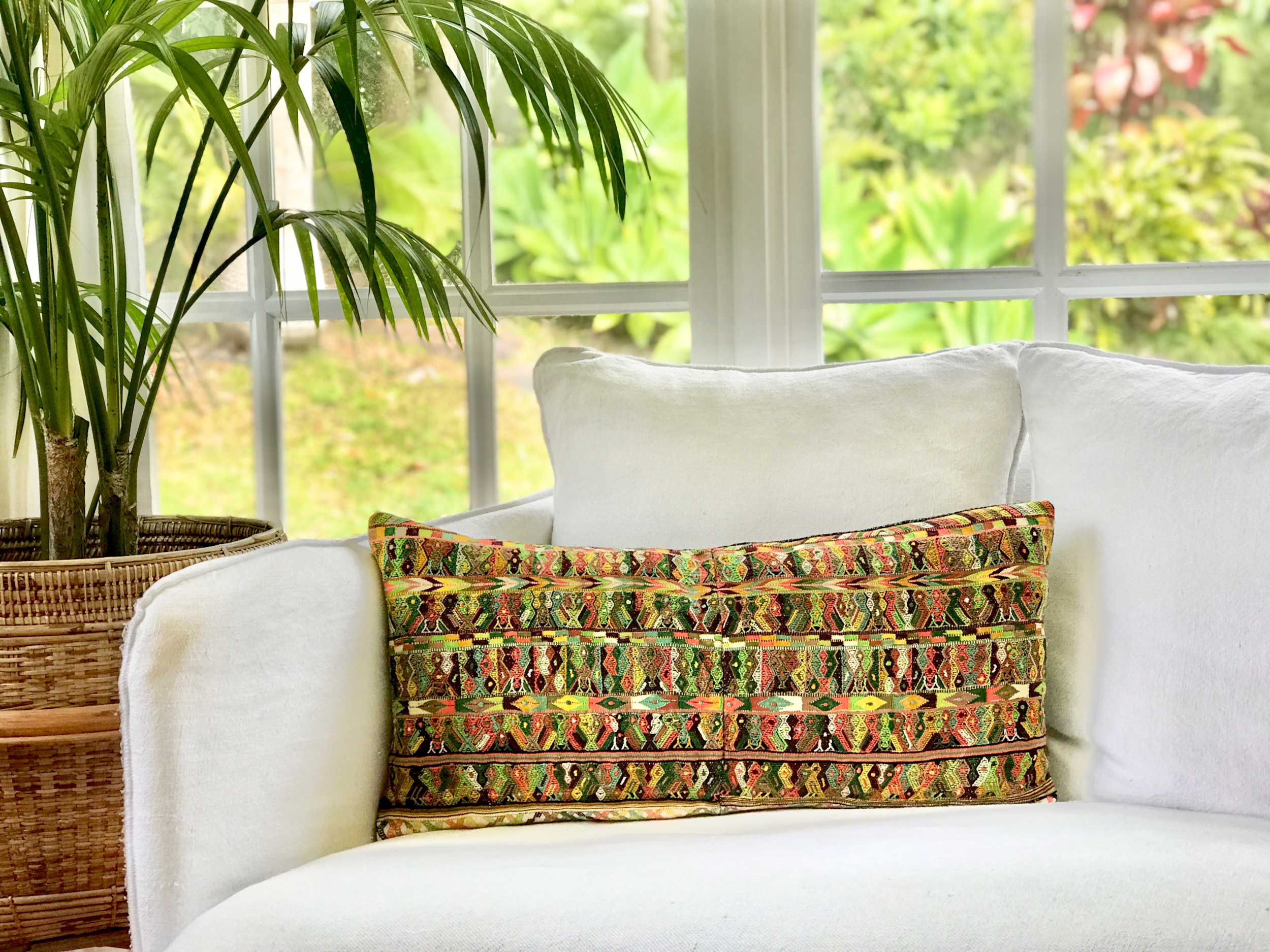Vintage textile cushions made from a Guatemalan huipil and corte.