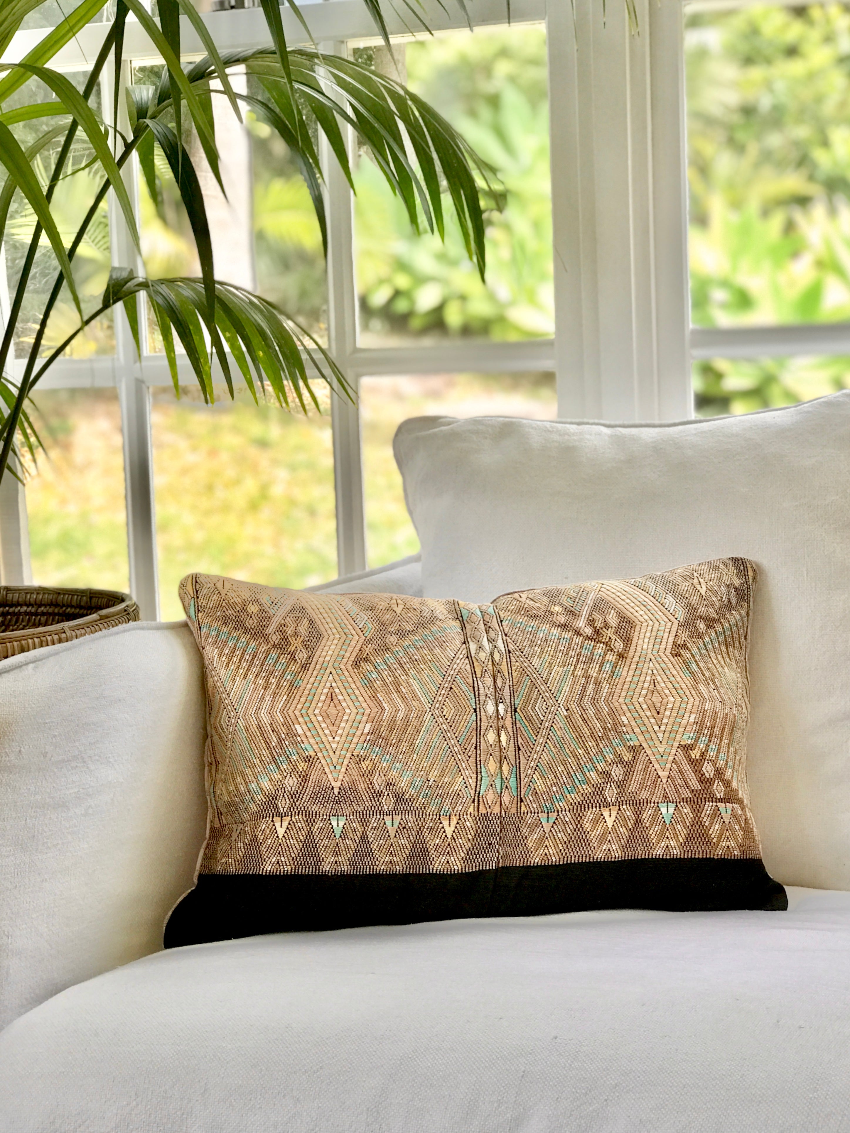 Vintage textile cushions made from a Guatemalan huipil and corte.
