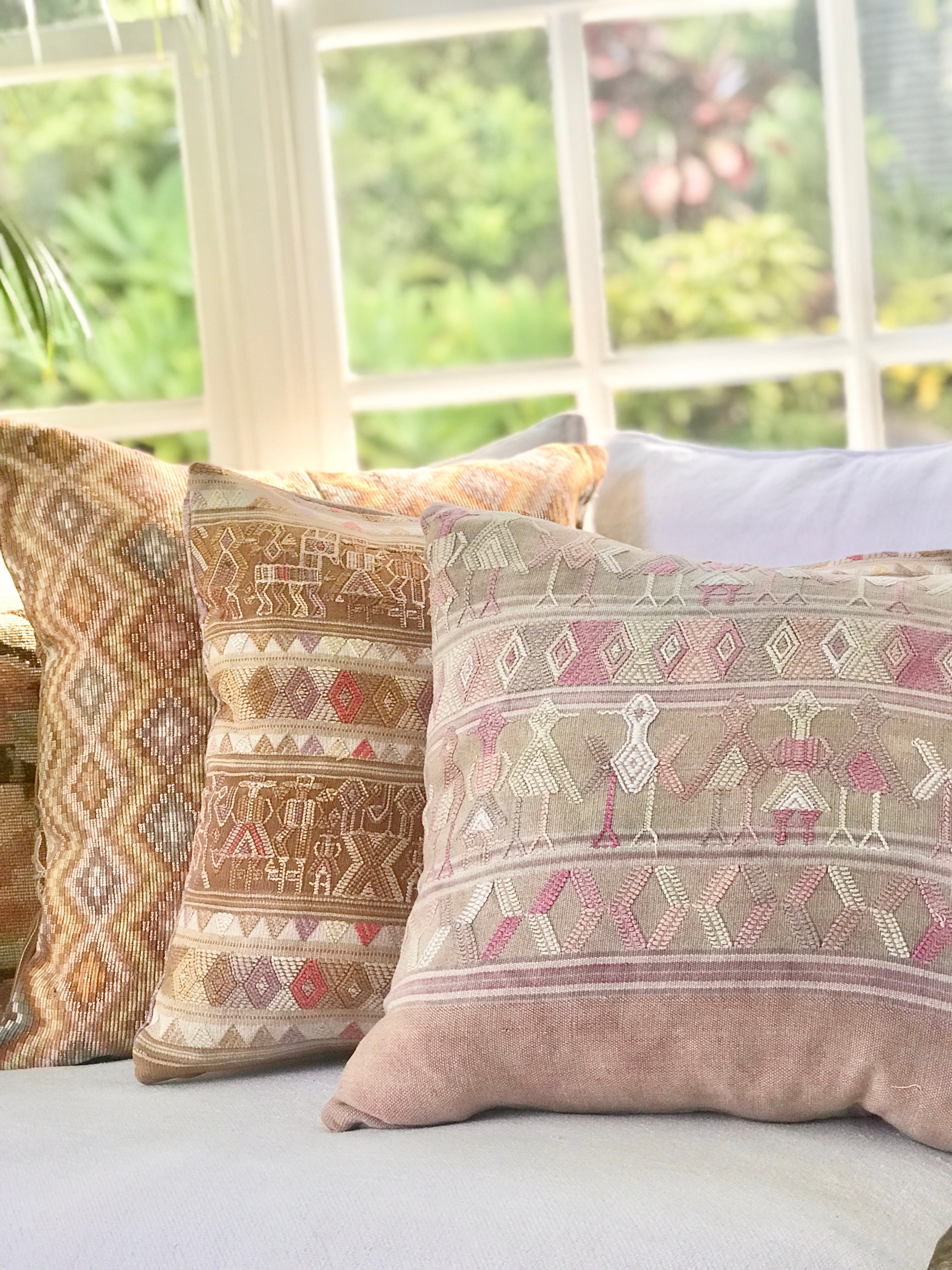 Vintage textile cushions made from a Guatemalan huipil and corte.
