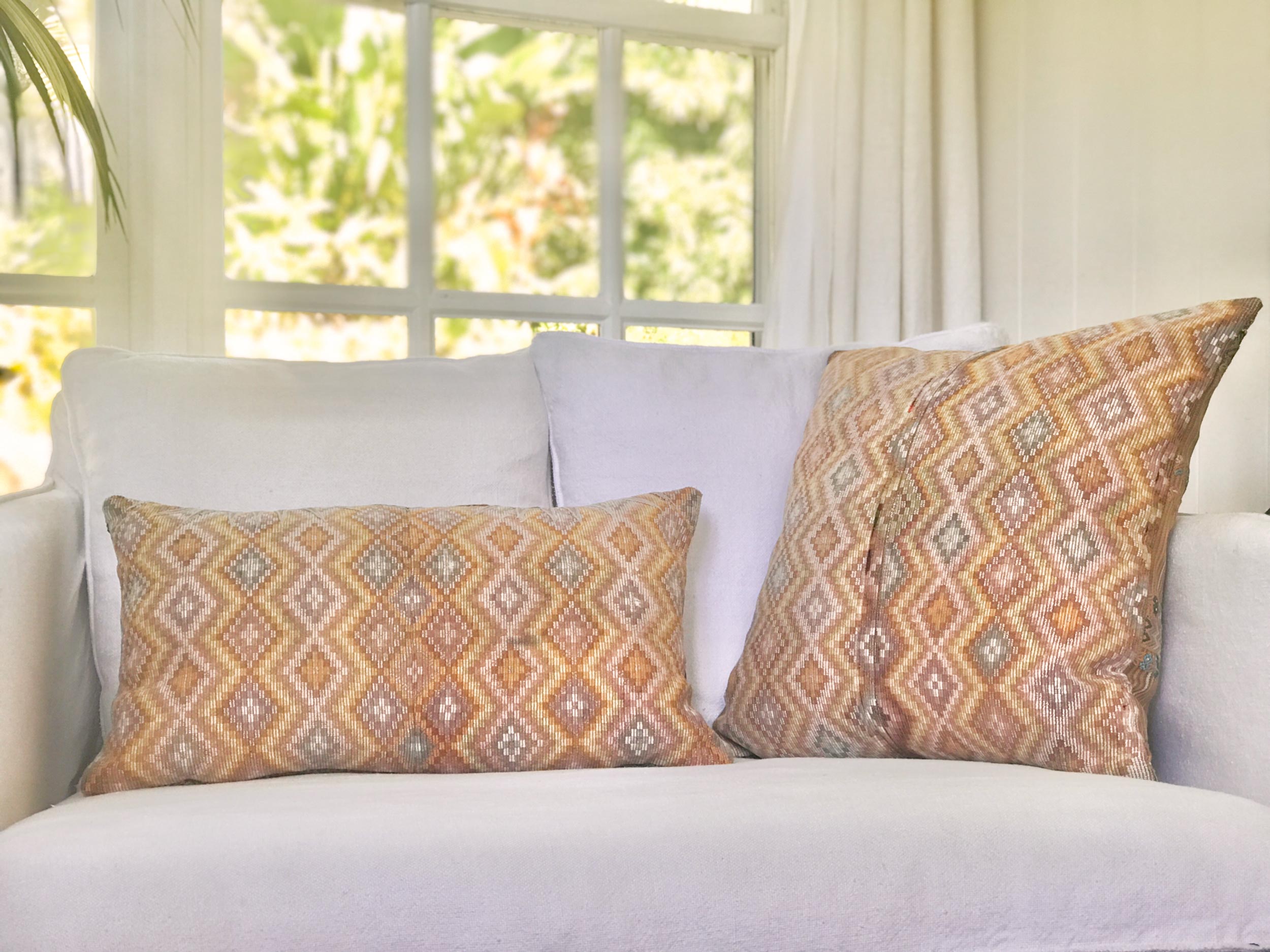Vintage textile pillows made from a Guatemalan huipil and corte