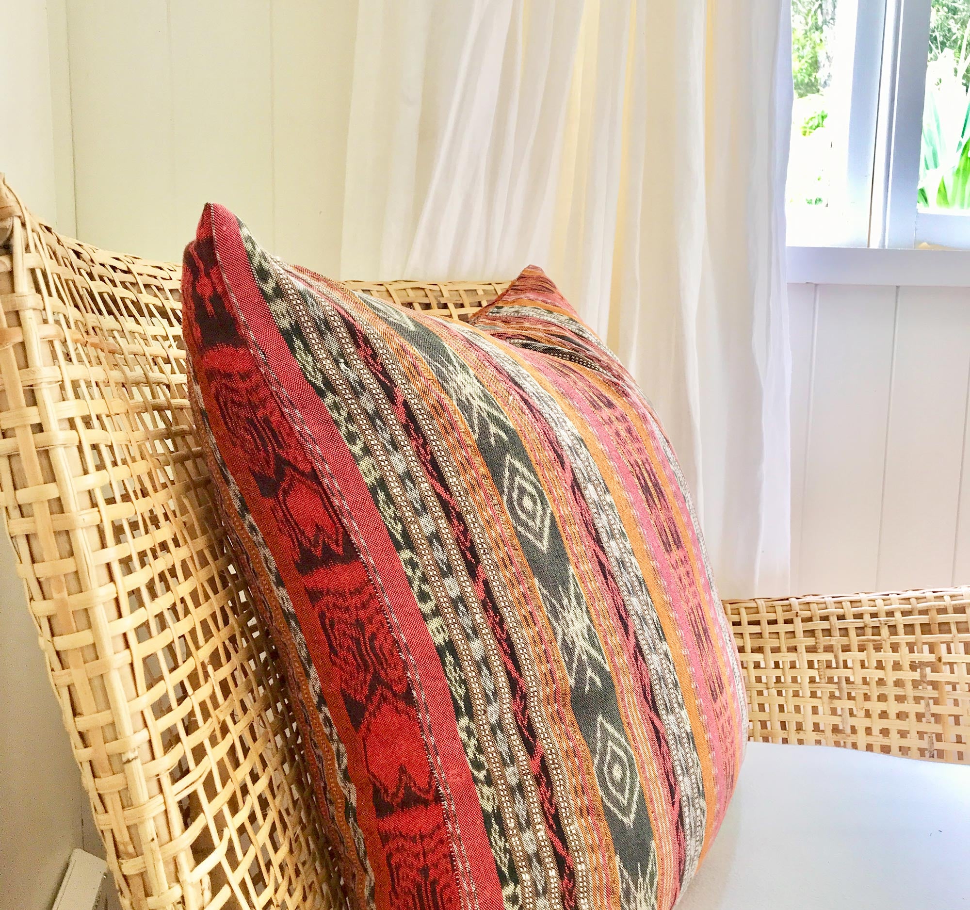 Vintage textile cushion made from a Guatemalan huipil and corte