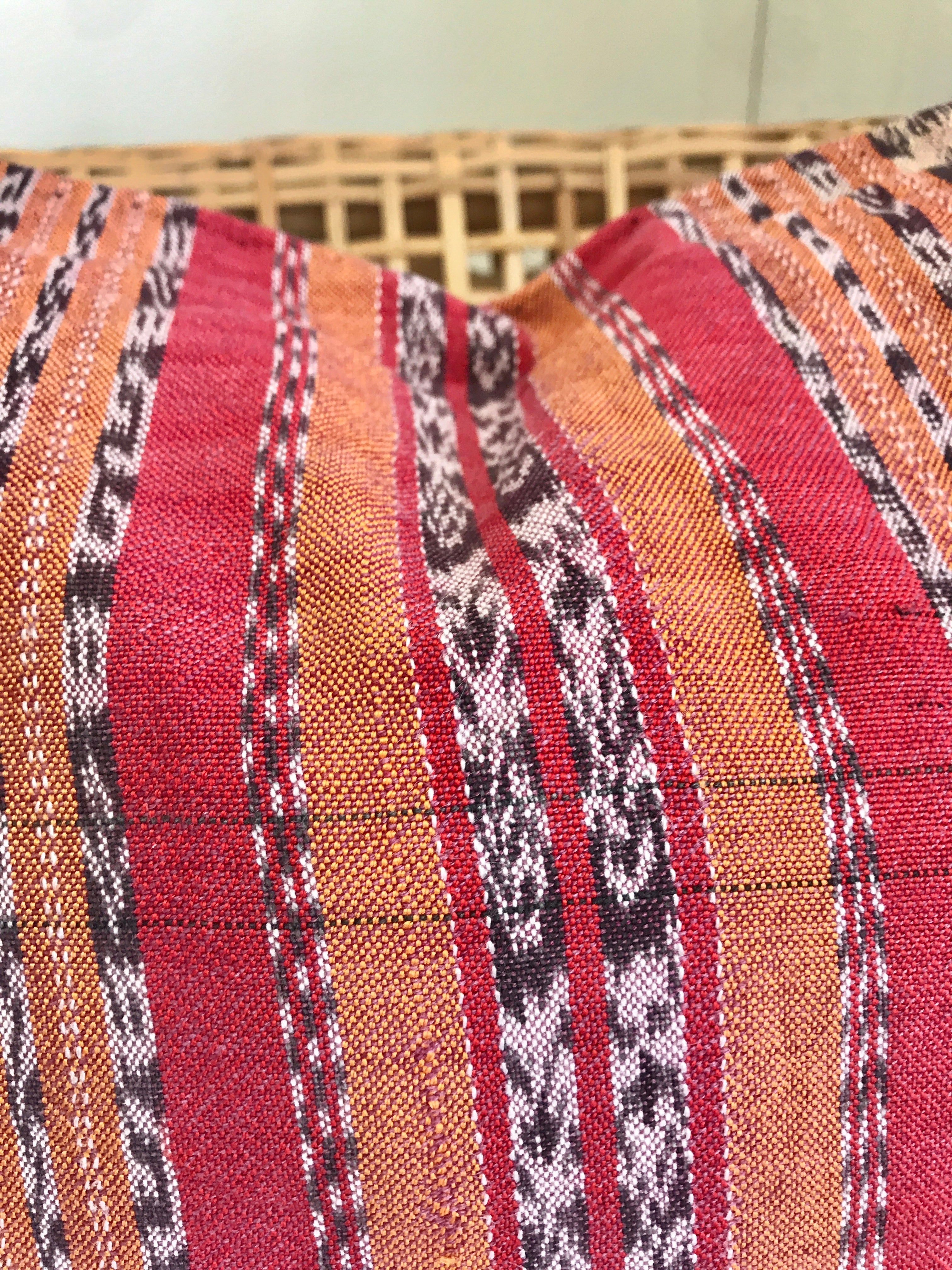 Vintage textile cushion made from a Guatemalan huipil and corte