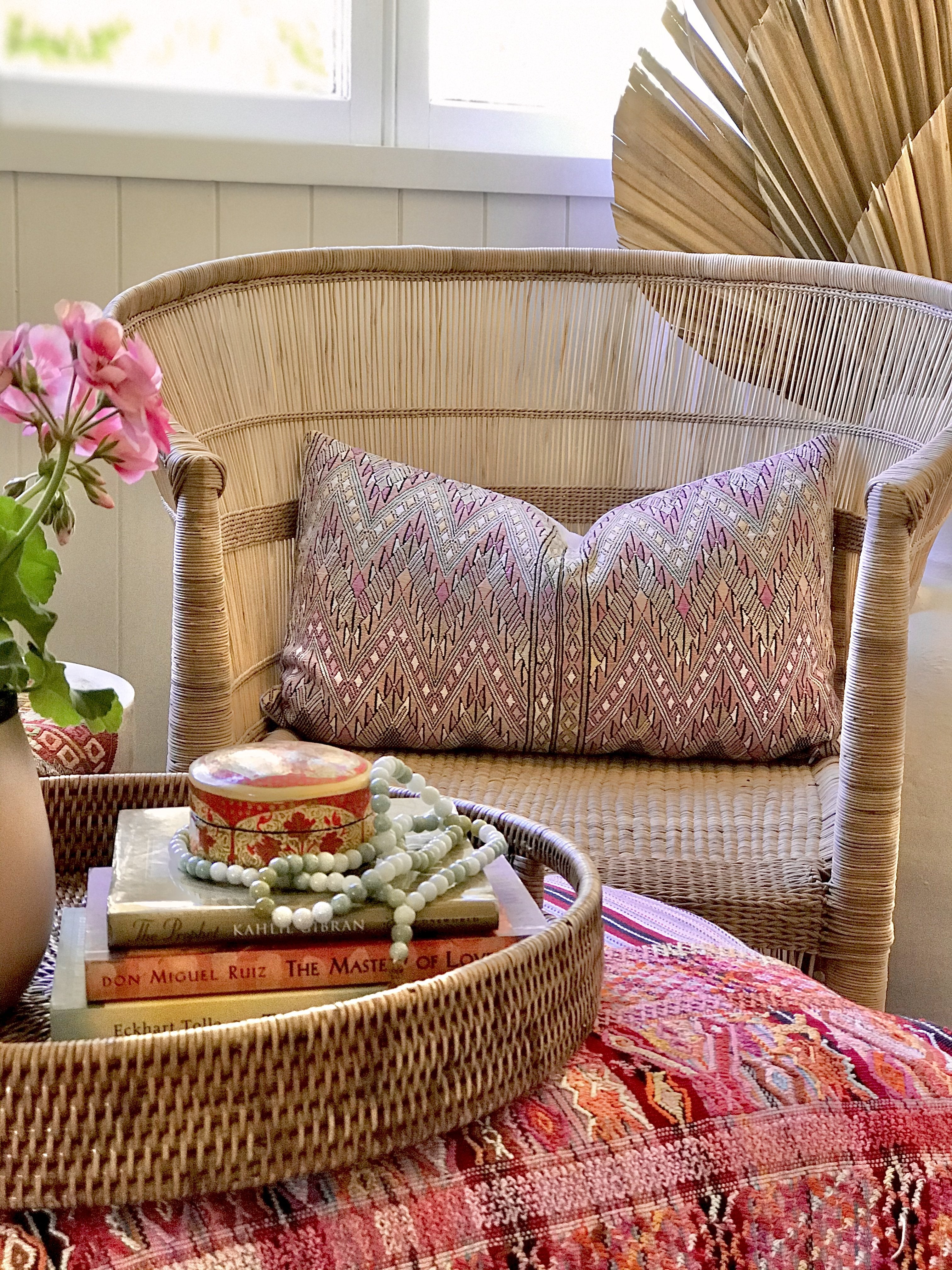 Guatemalan embroidered huipil pillow. Geometric chevron pattern in a pale pink palette.
