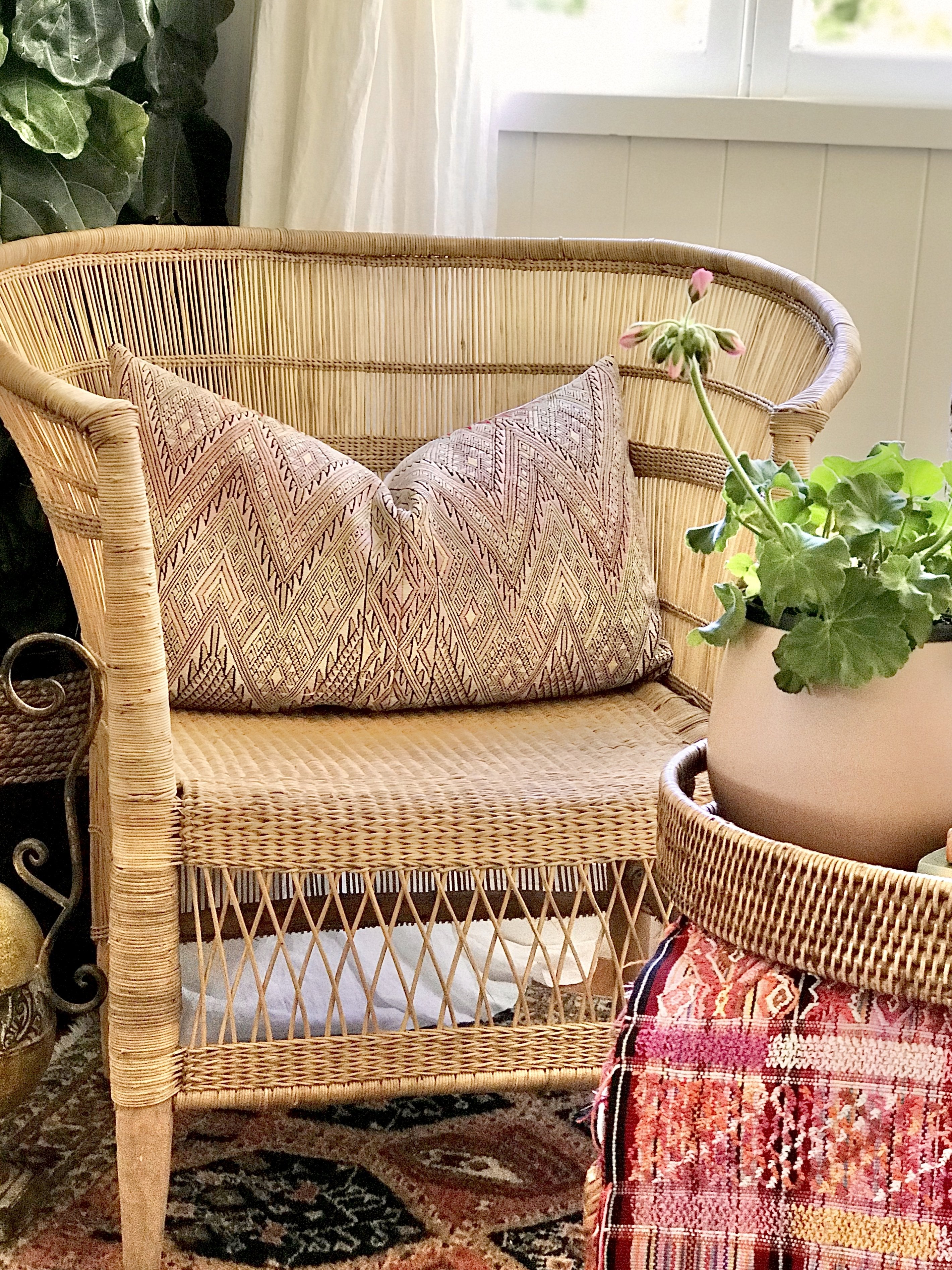 Guatemalan embroidered huipil pillow. Geometric chevron pattern in a pale pink palette.