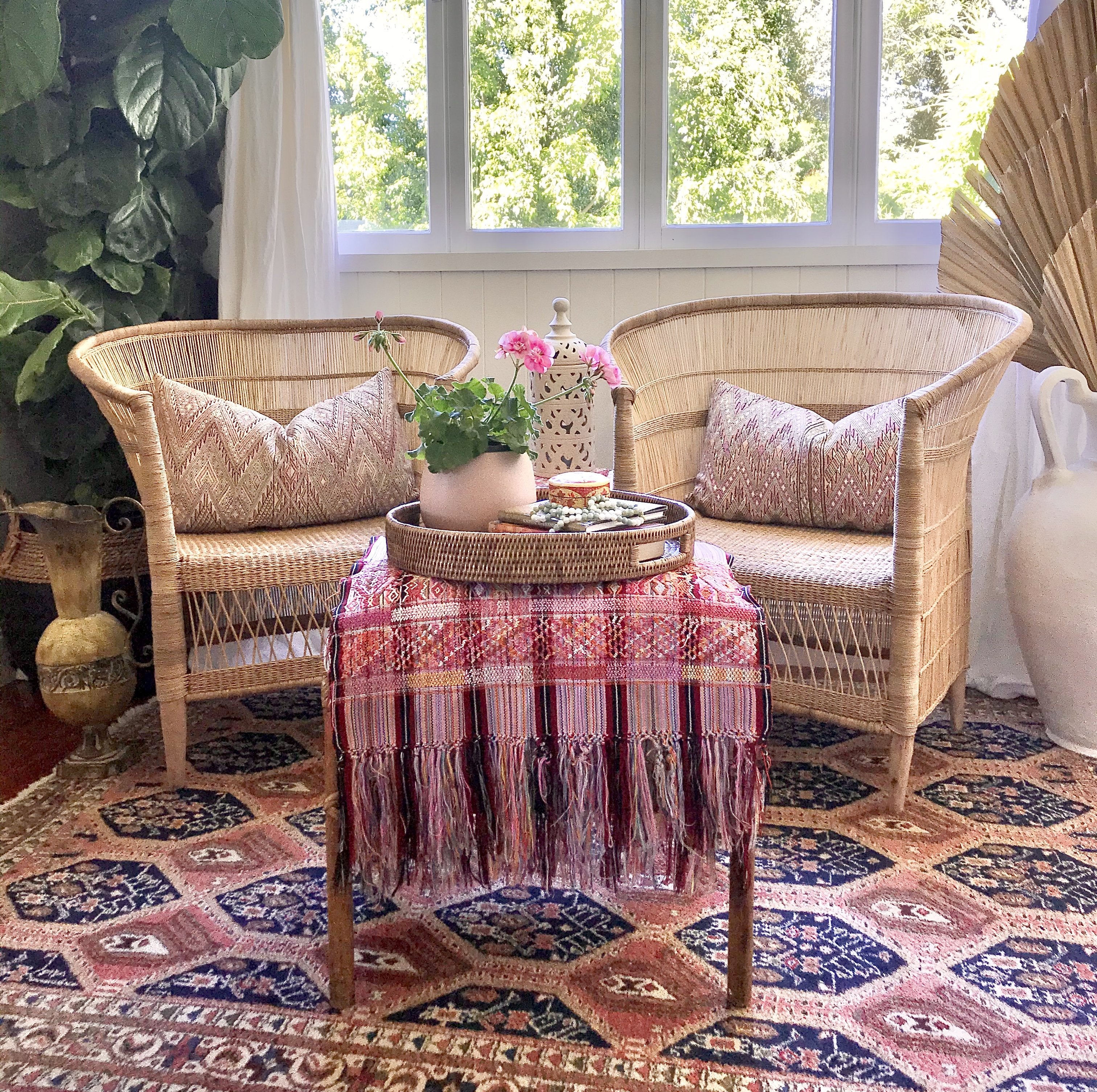 Guatemalan embroidered huipil pillow. Geometric chevron pattern in a pale pink palette.