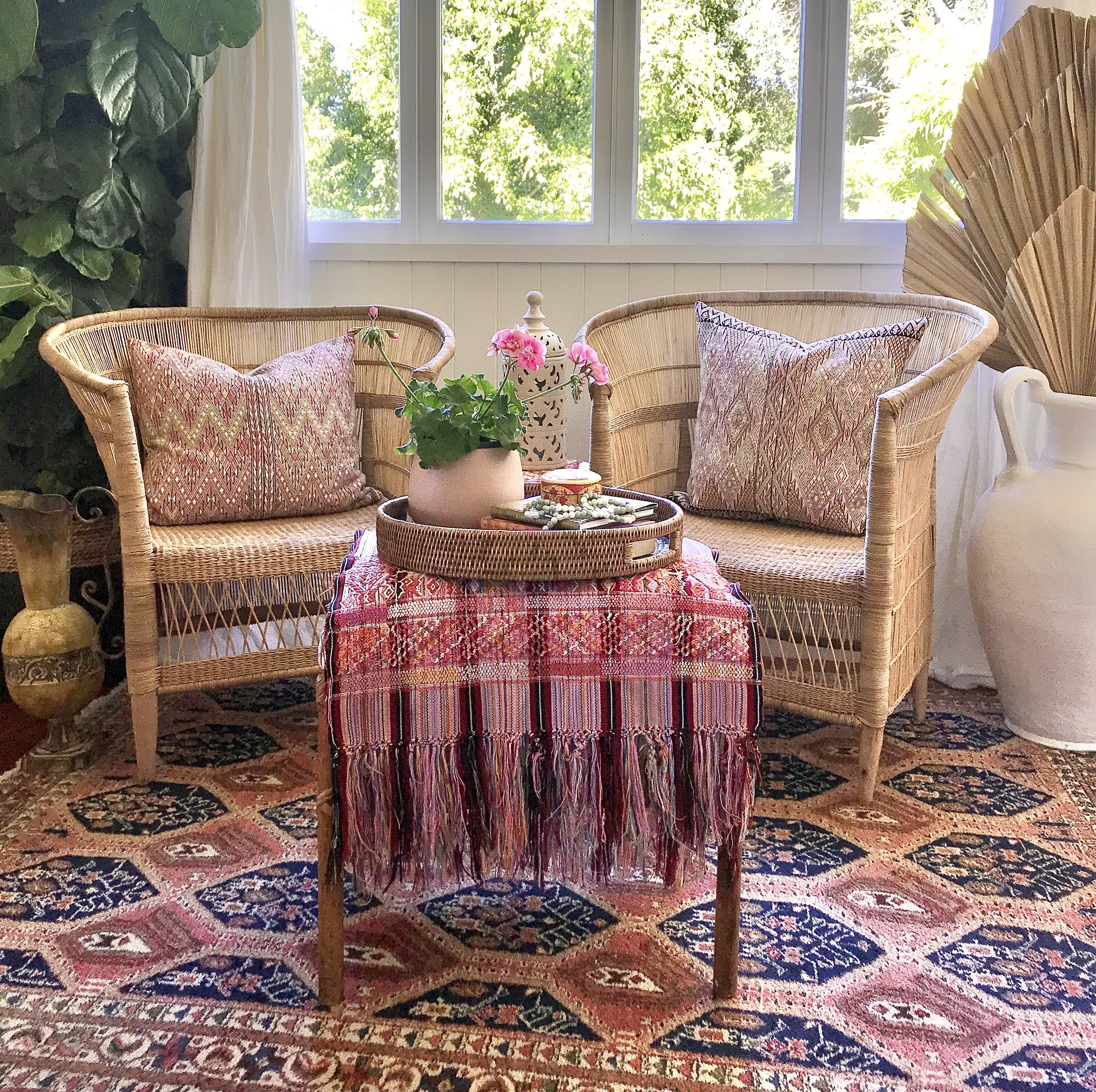 Guatemalan embroidered huipil pillow. Geometric chevron pattern in a pale pink palette.