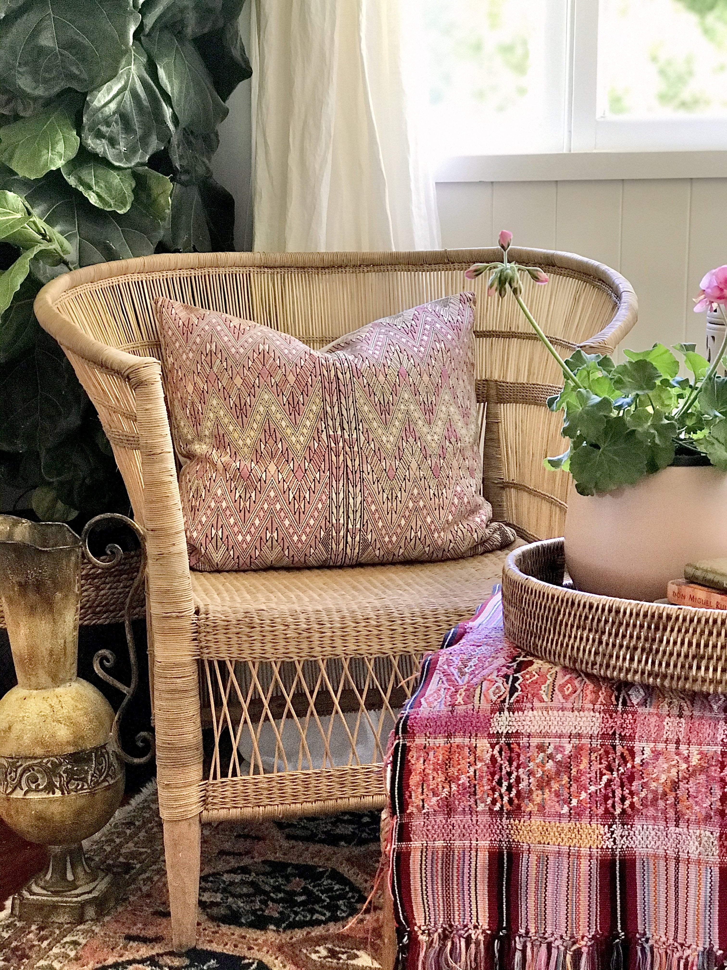 Guatemalan embroidered huipil pillow. Geometric chevron pattern in a pale pink palette.
