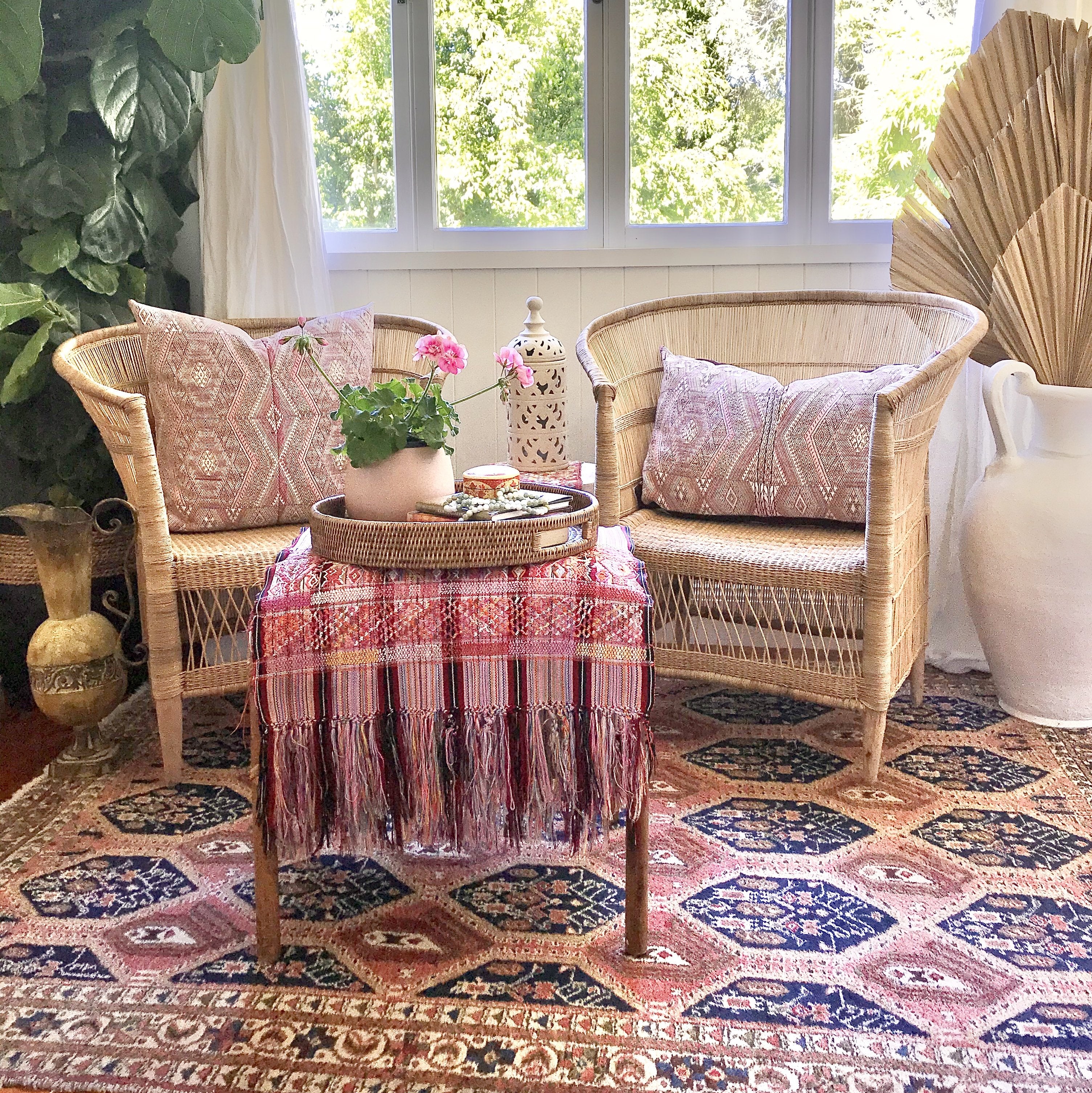 Guatemalan embroidered huipil pillow. Geometric chevron pattern in a pale pink palette.