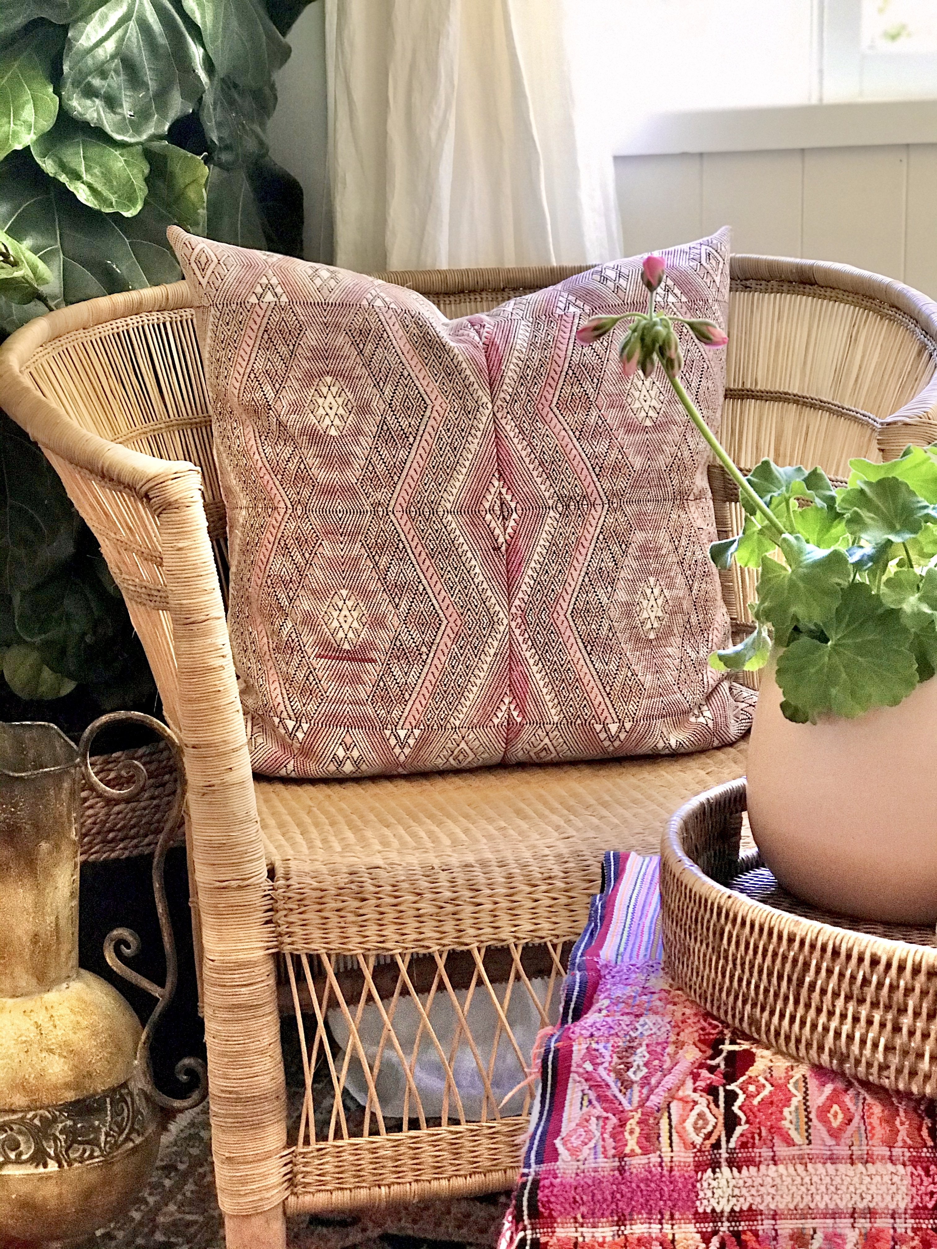 Guatemalan embroidered huipil pillow. Geometric chevron pattern in a pale pink palette.
