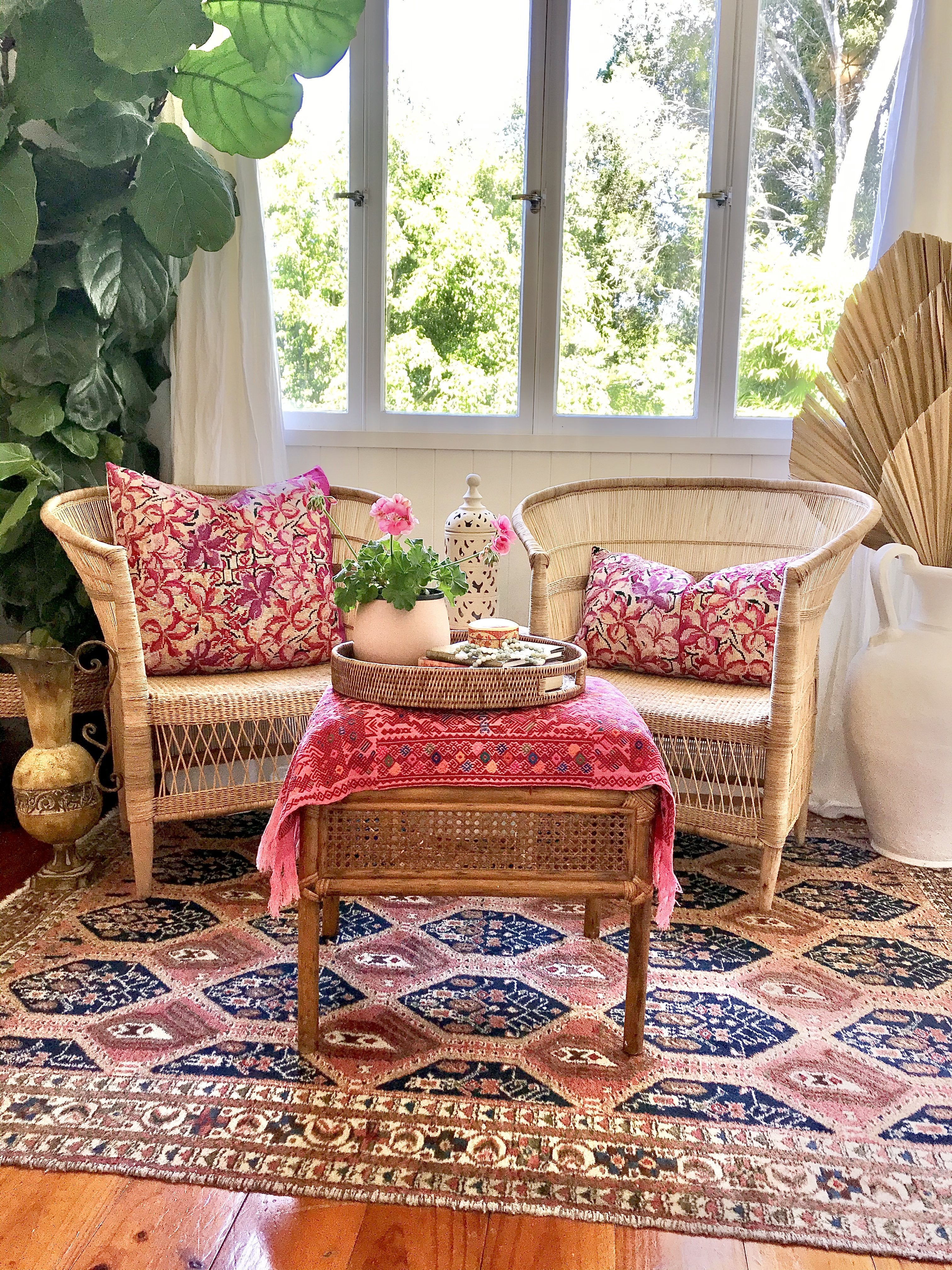 Guatemalan embroidered huipil pillow. A fuchsia vintage textile with an abstract floral design.