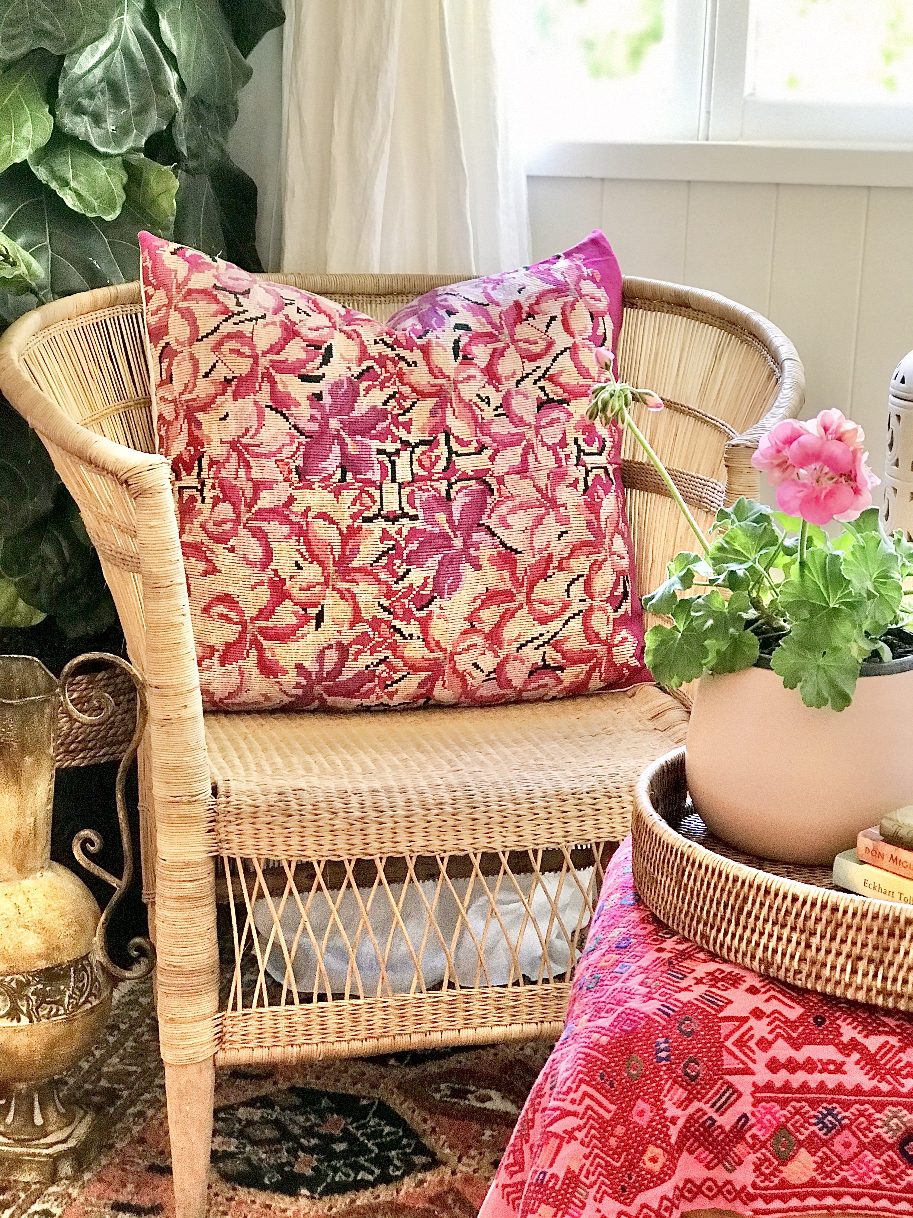 Guatemalan embroidered huipil pillow. A fuchsia vintage textile with an abstract floral design.