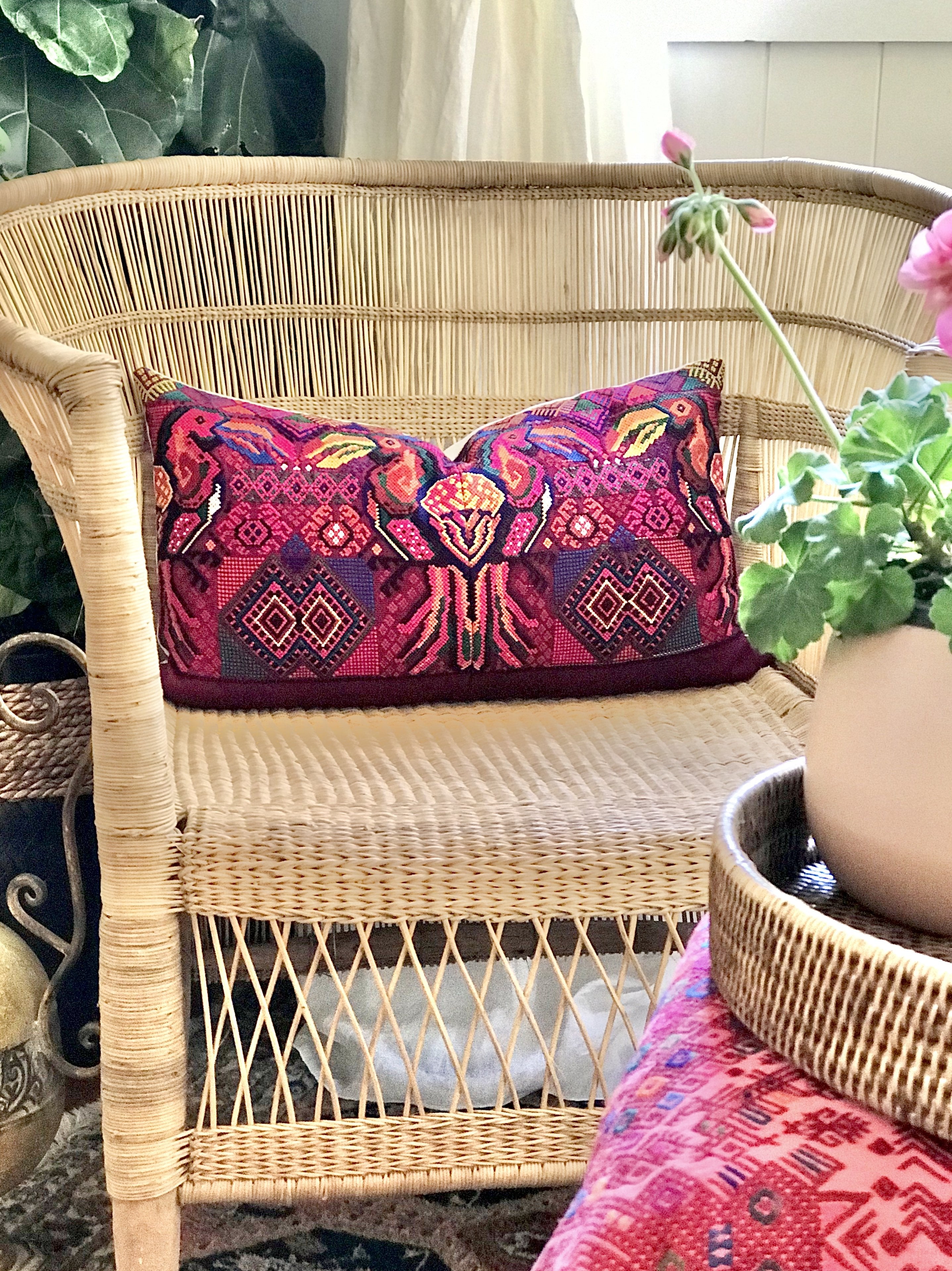 Guatemalan embroidered huipil pillow. A fuchsia vintage textile with colourful kissing Toucans bird design.