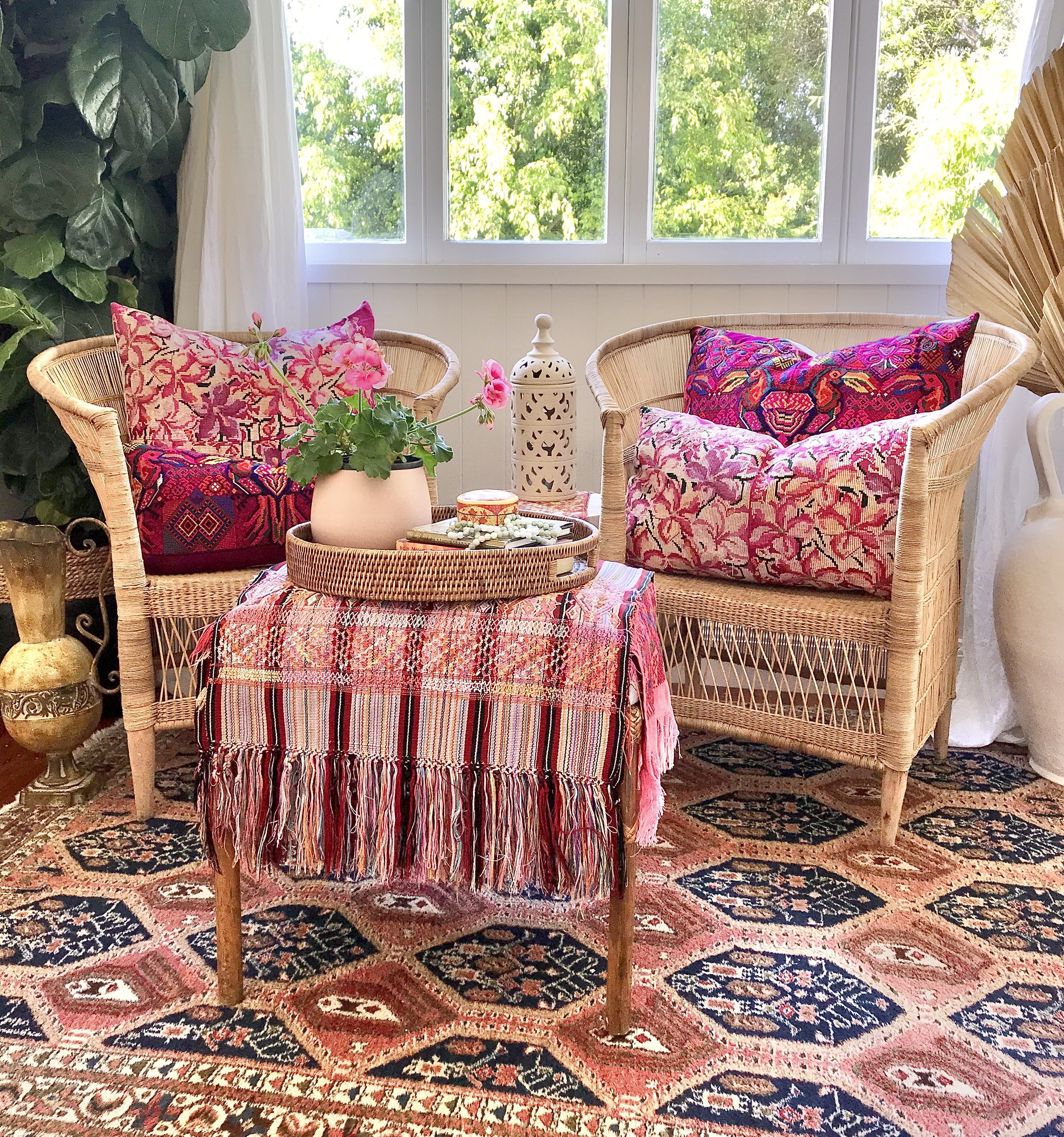 Guatemalan embroidered huipil pillow. A fuchsia vintage textile with an abstract floral design.