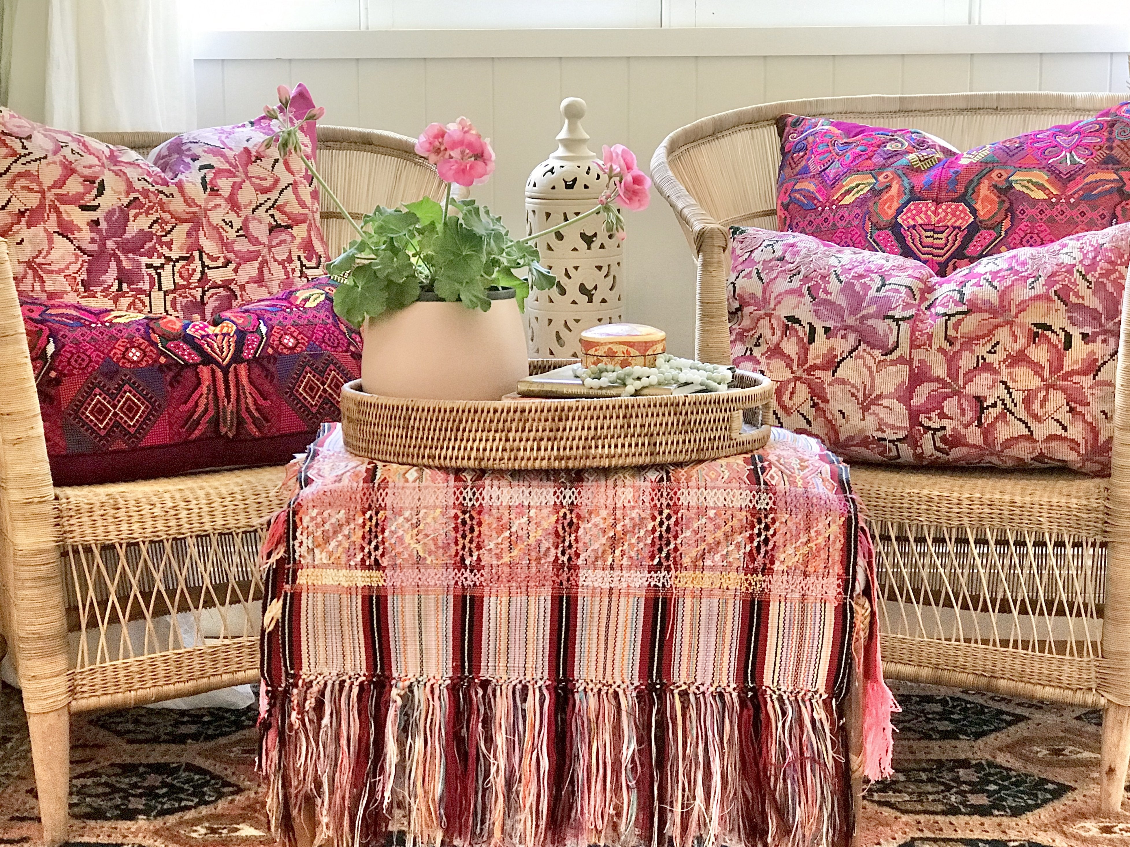 Guatemalan embroidered huipil pillow. A fuchsia vintage textile with an abstract floral design.