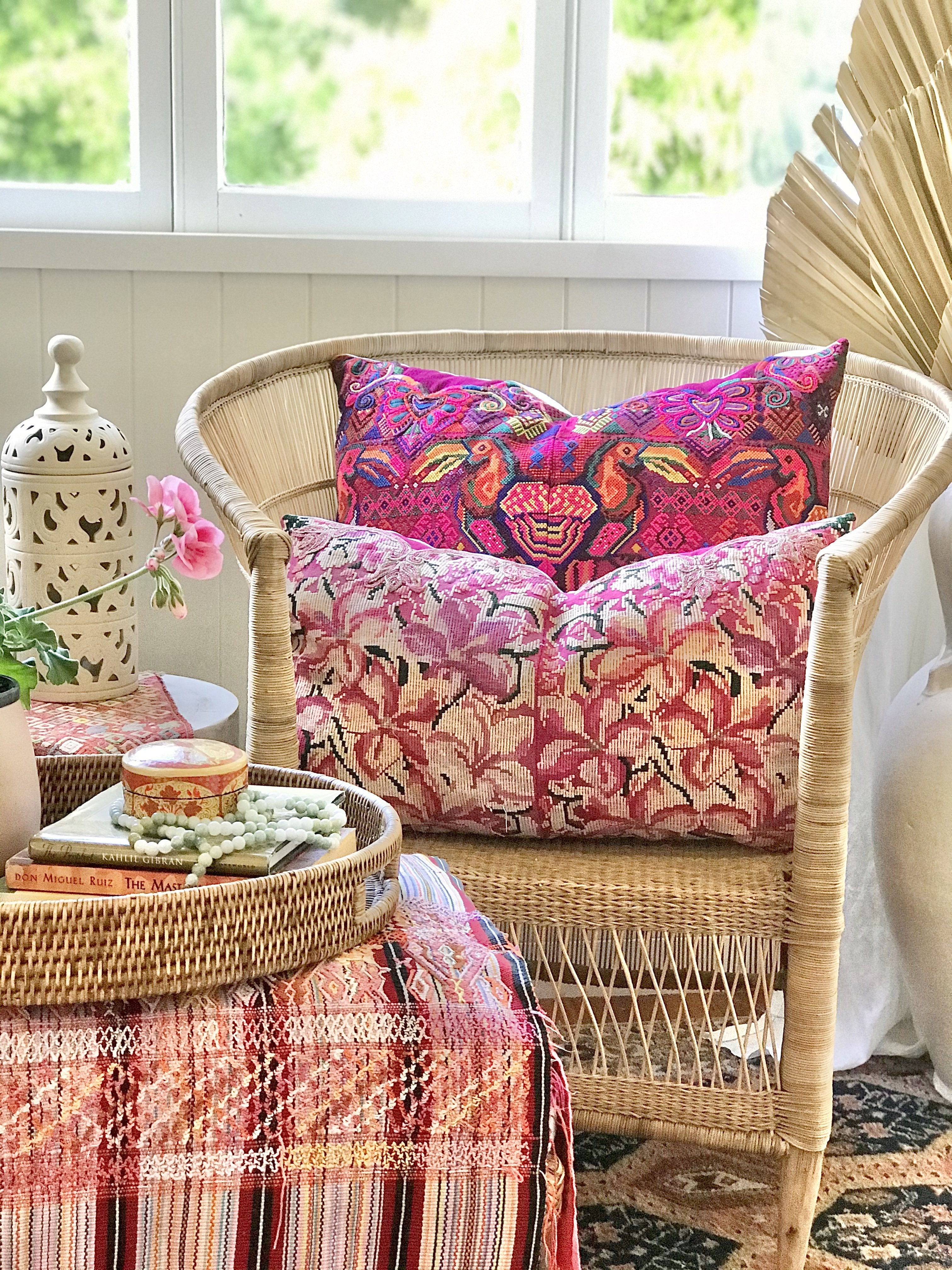 Guatemalan embroidered huipil pillow. A fuchsia vintage textile with an abstract floral design.