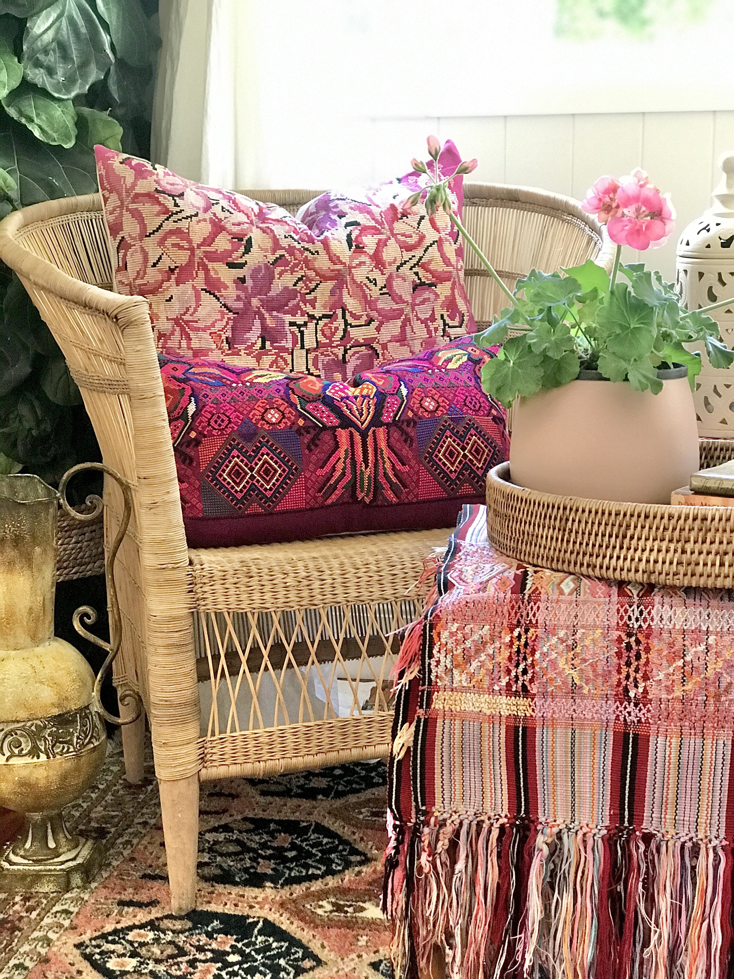 Guatemalan embroidered huipil pillow. A fuchsia vintage textile with an abstract floral design.