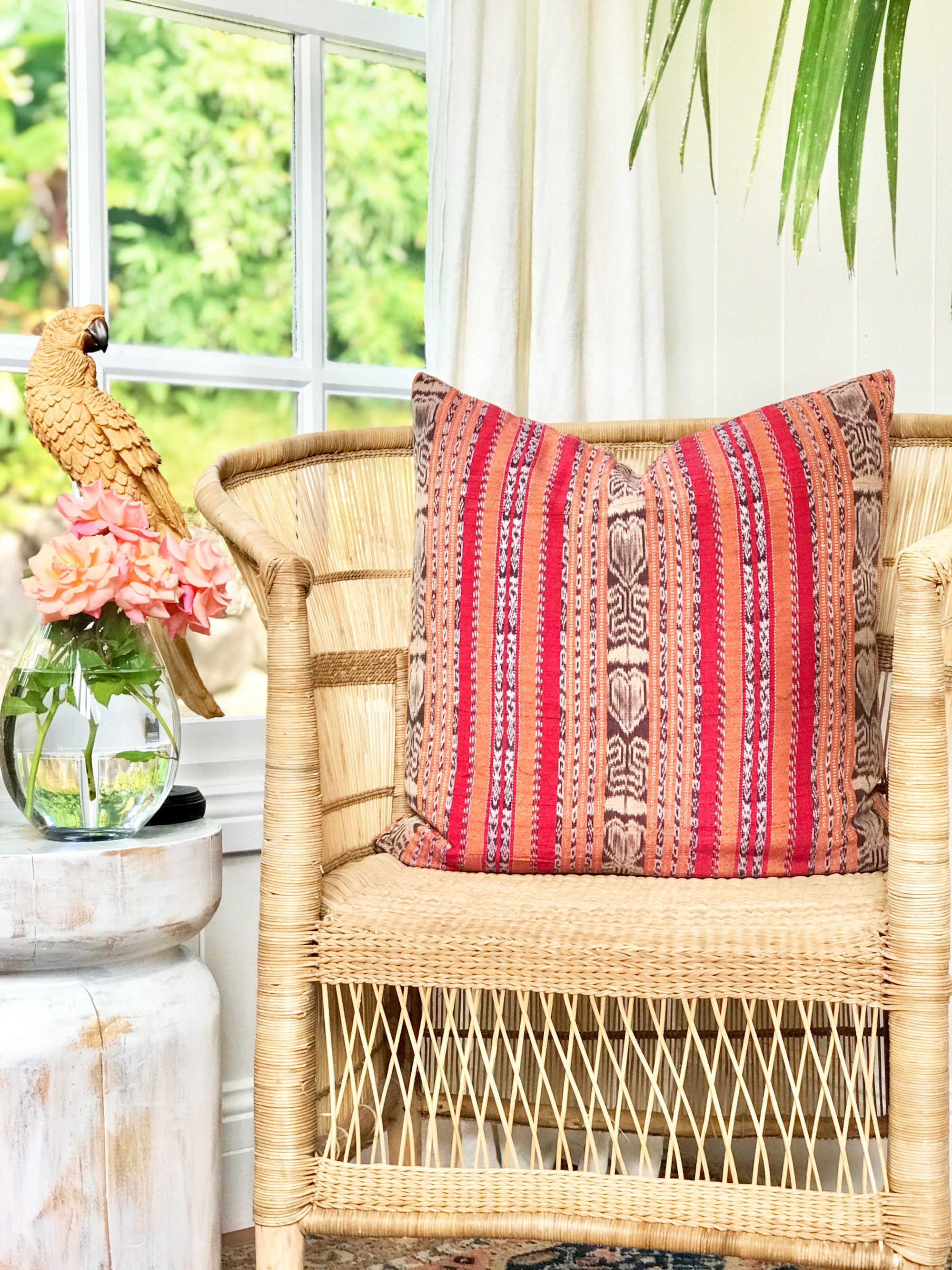 Vintage textile cushion made from a Guatemalan huipil and corte